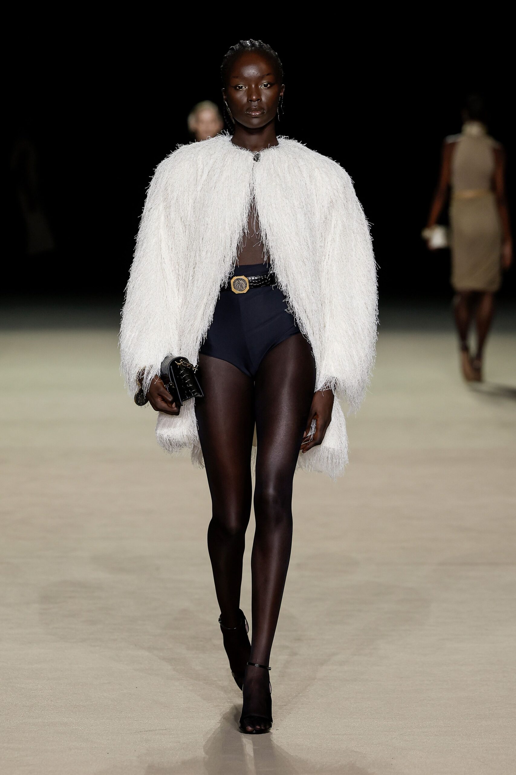 white fur coat black swimsuit
