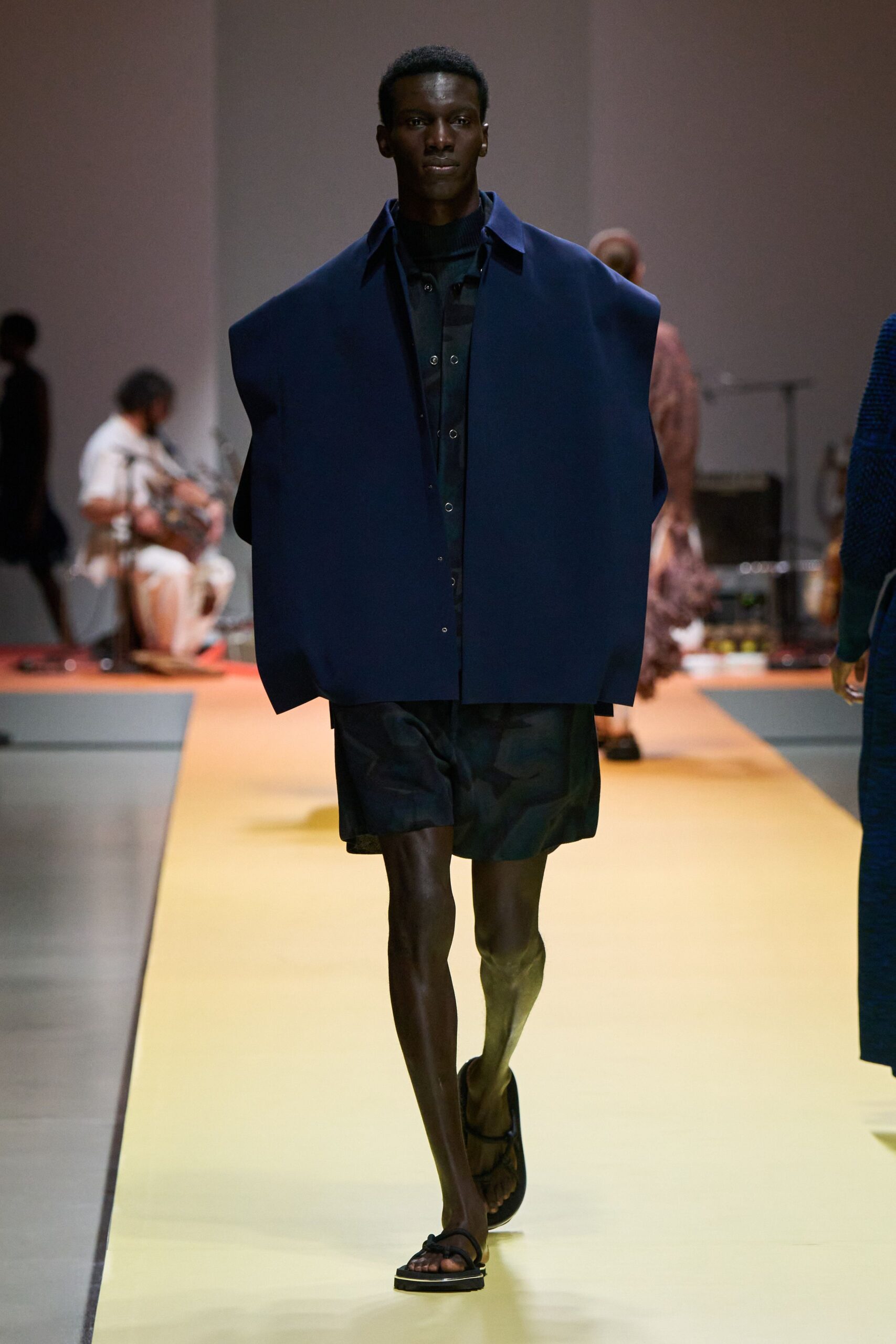 oversized blue jacket with black shirt and shorts