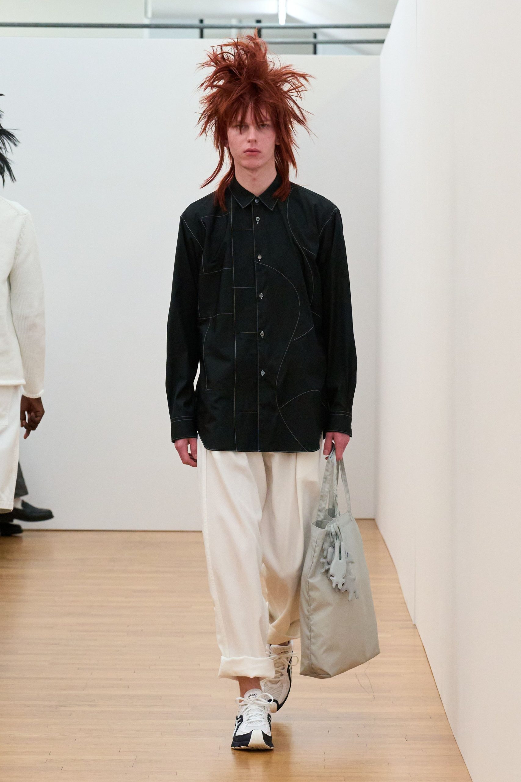 black shirt white pants