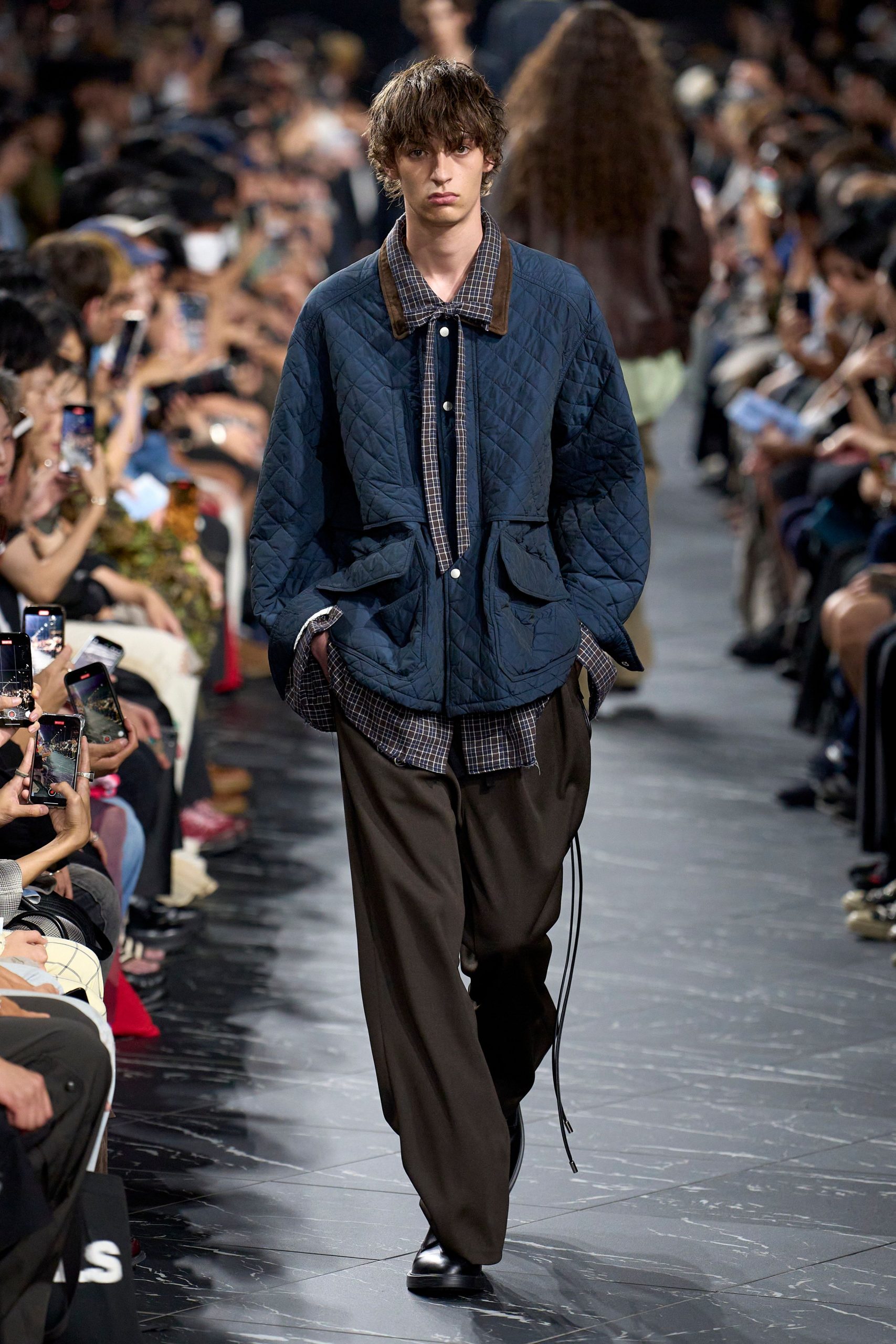 blue quilted jacket with gray shirt