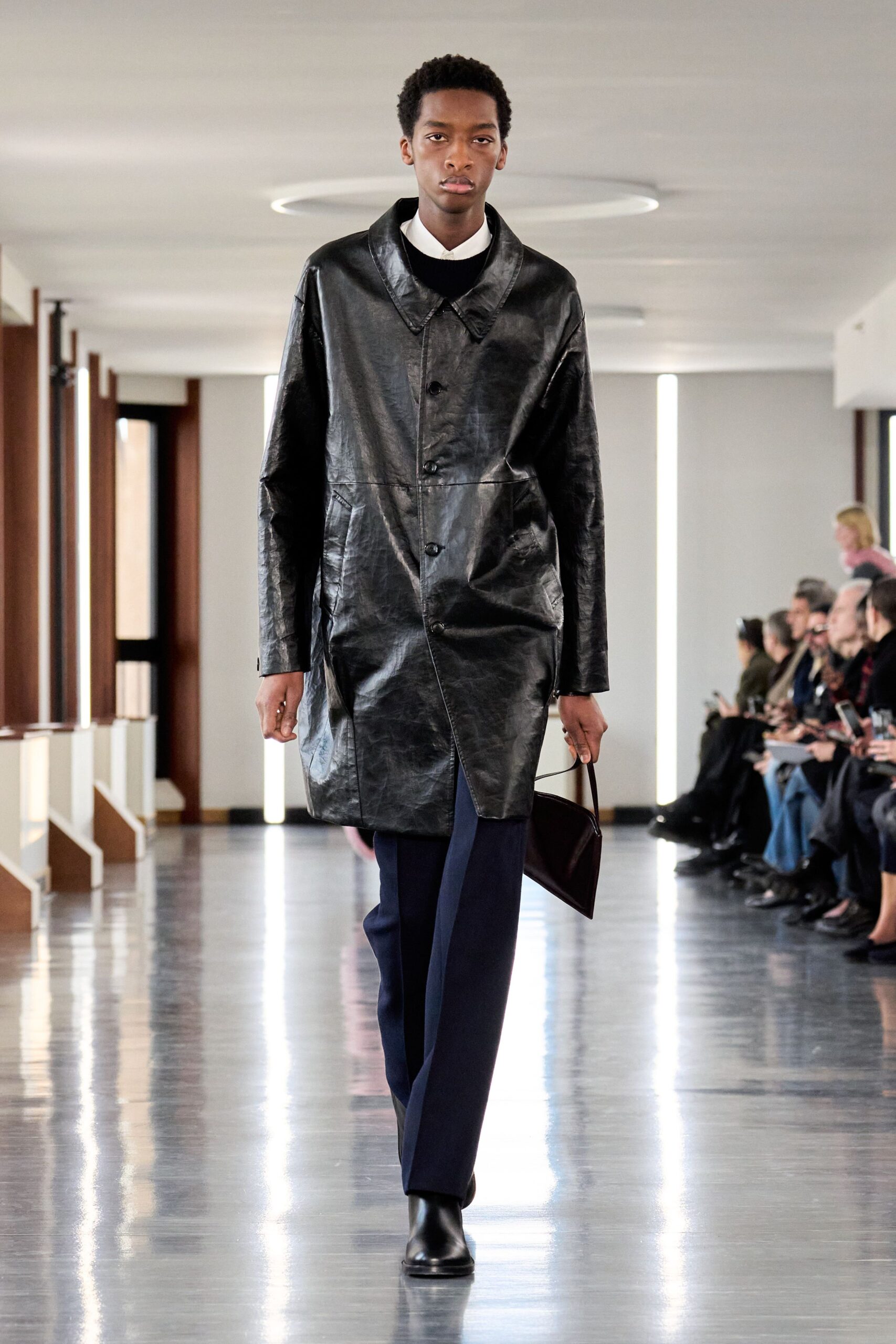 black leather coat with tailored pants