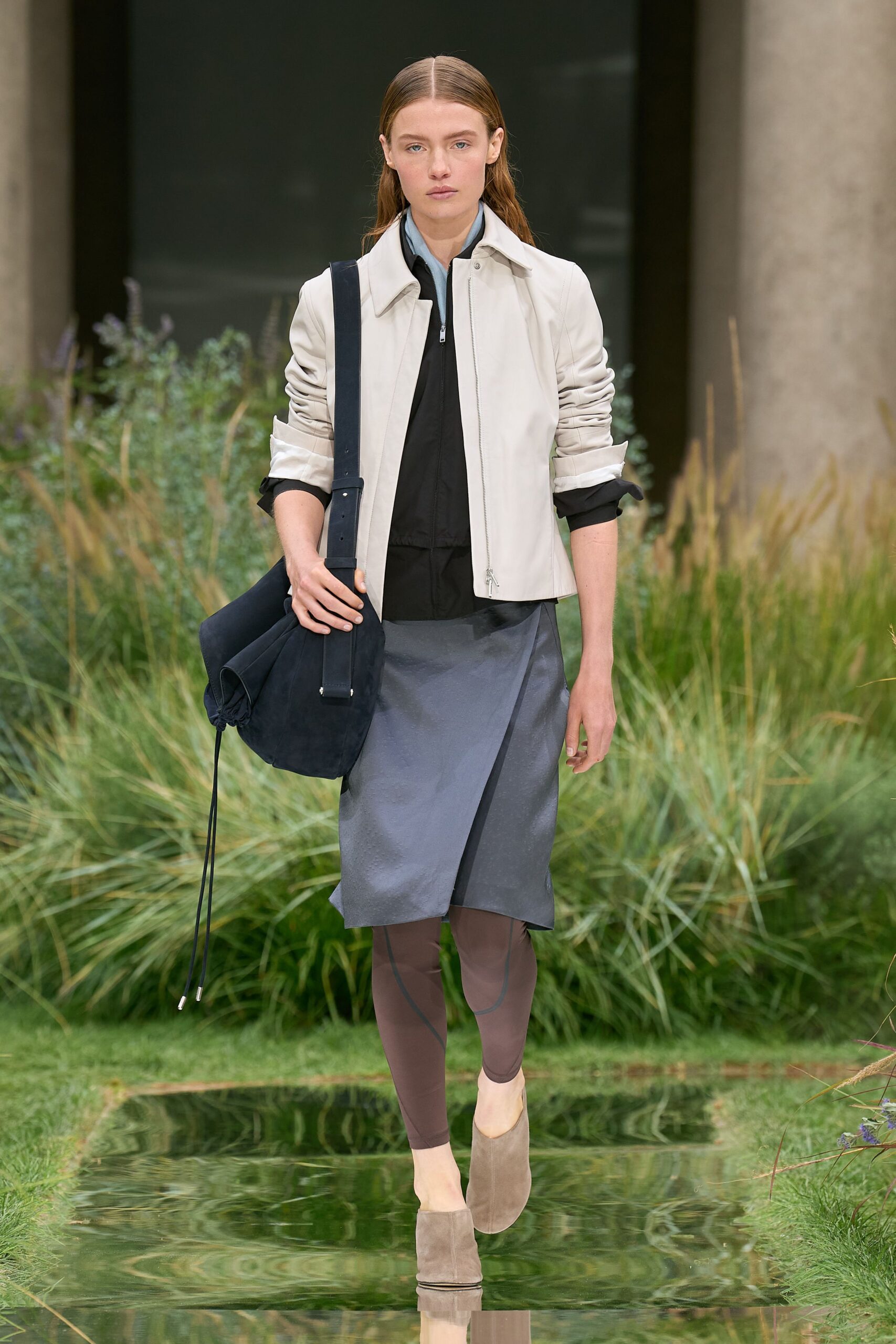 white jacket black top gray skirt