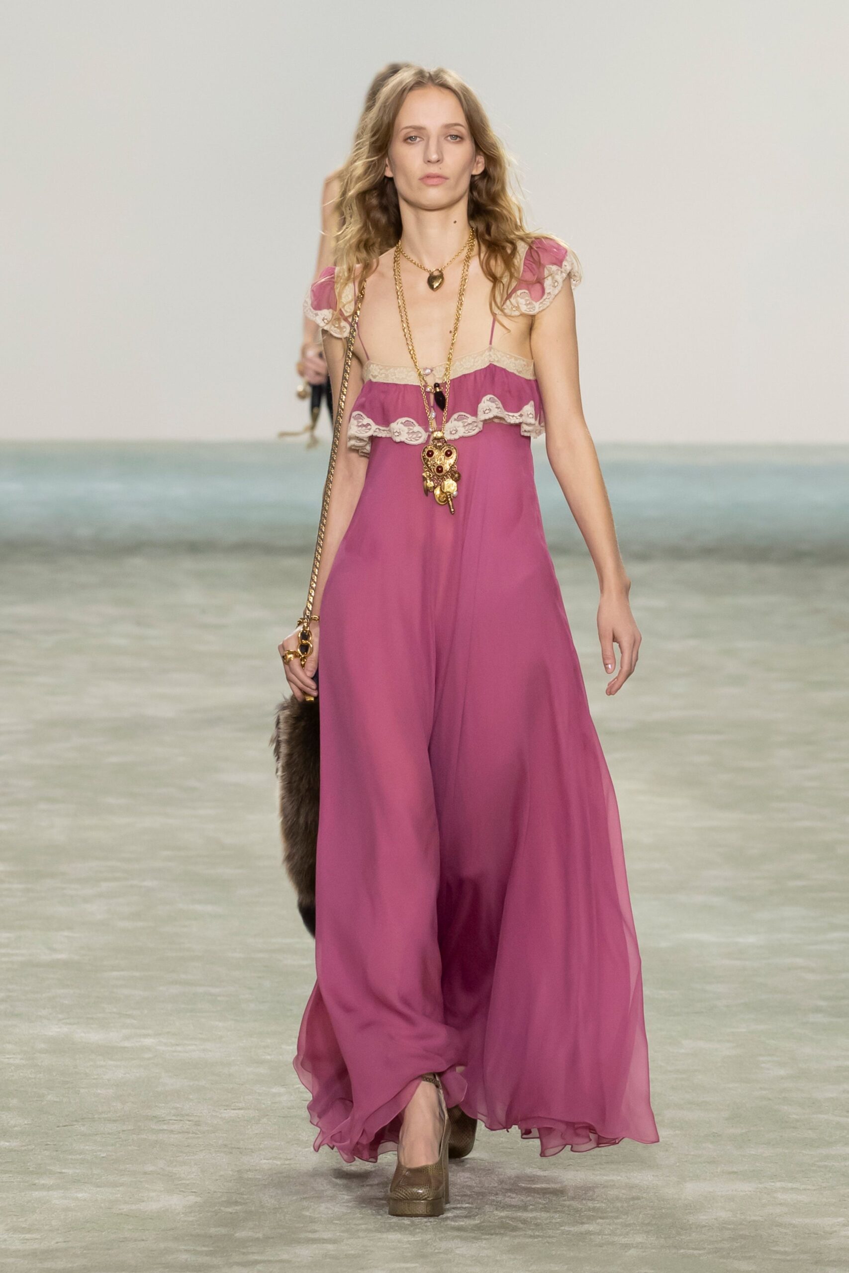 pink silk ruffled gown with platform shoes