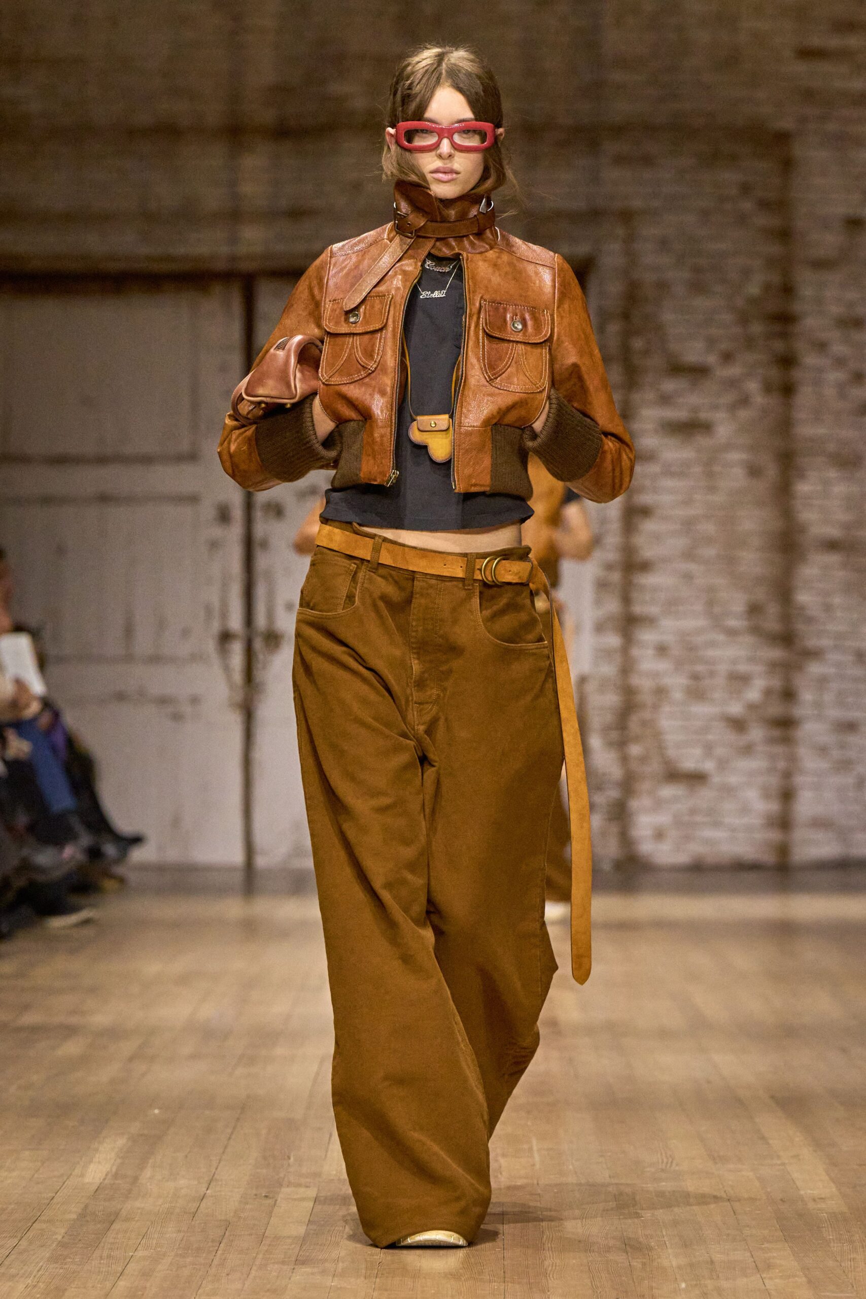 brown leather jacket with black top