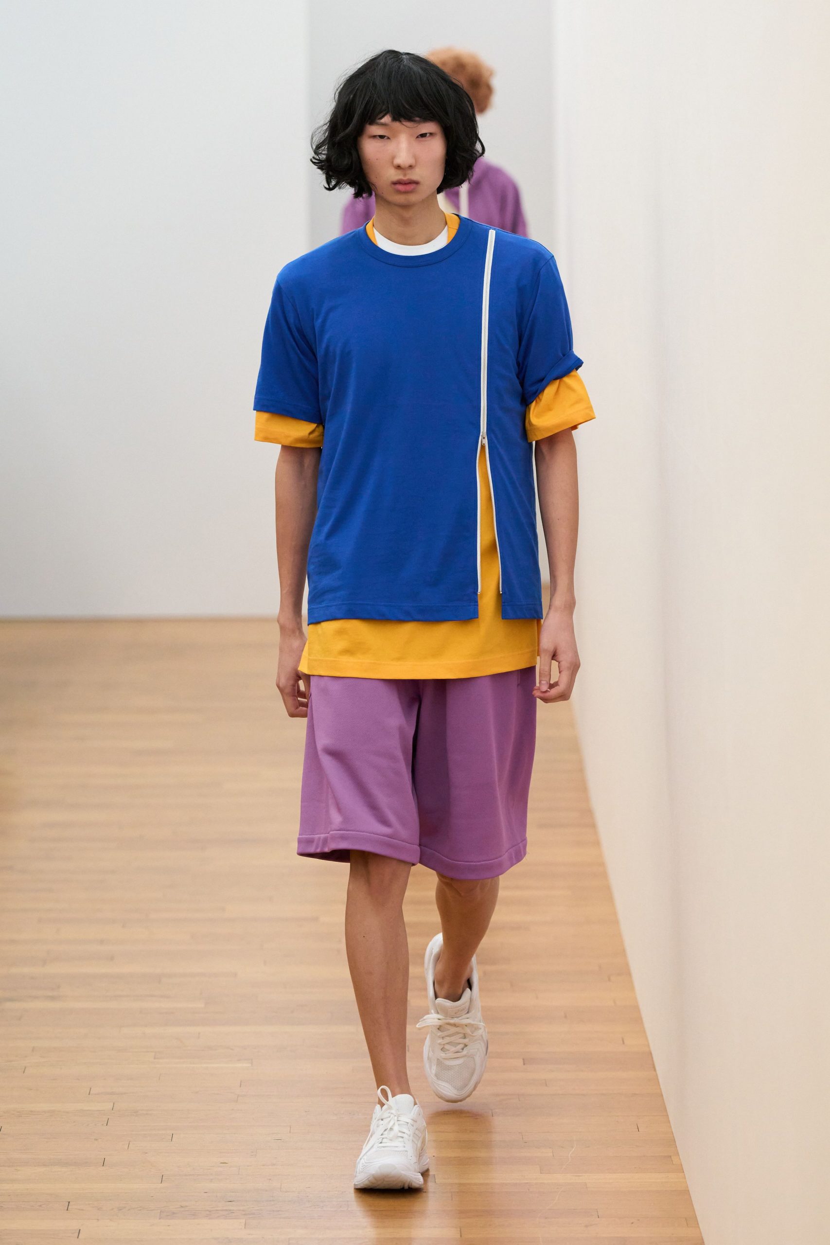 blue and yellow t-shirt with purple shorts