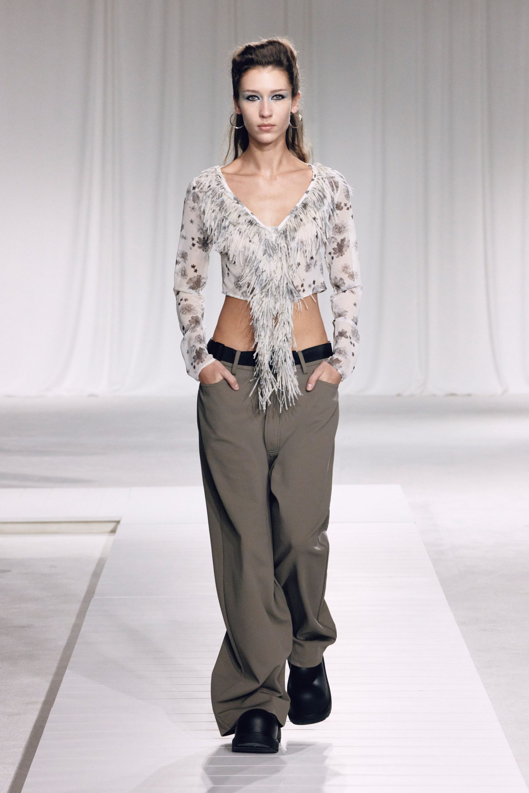fringed white top with beige pants