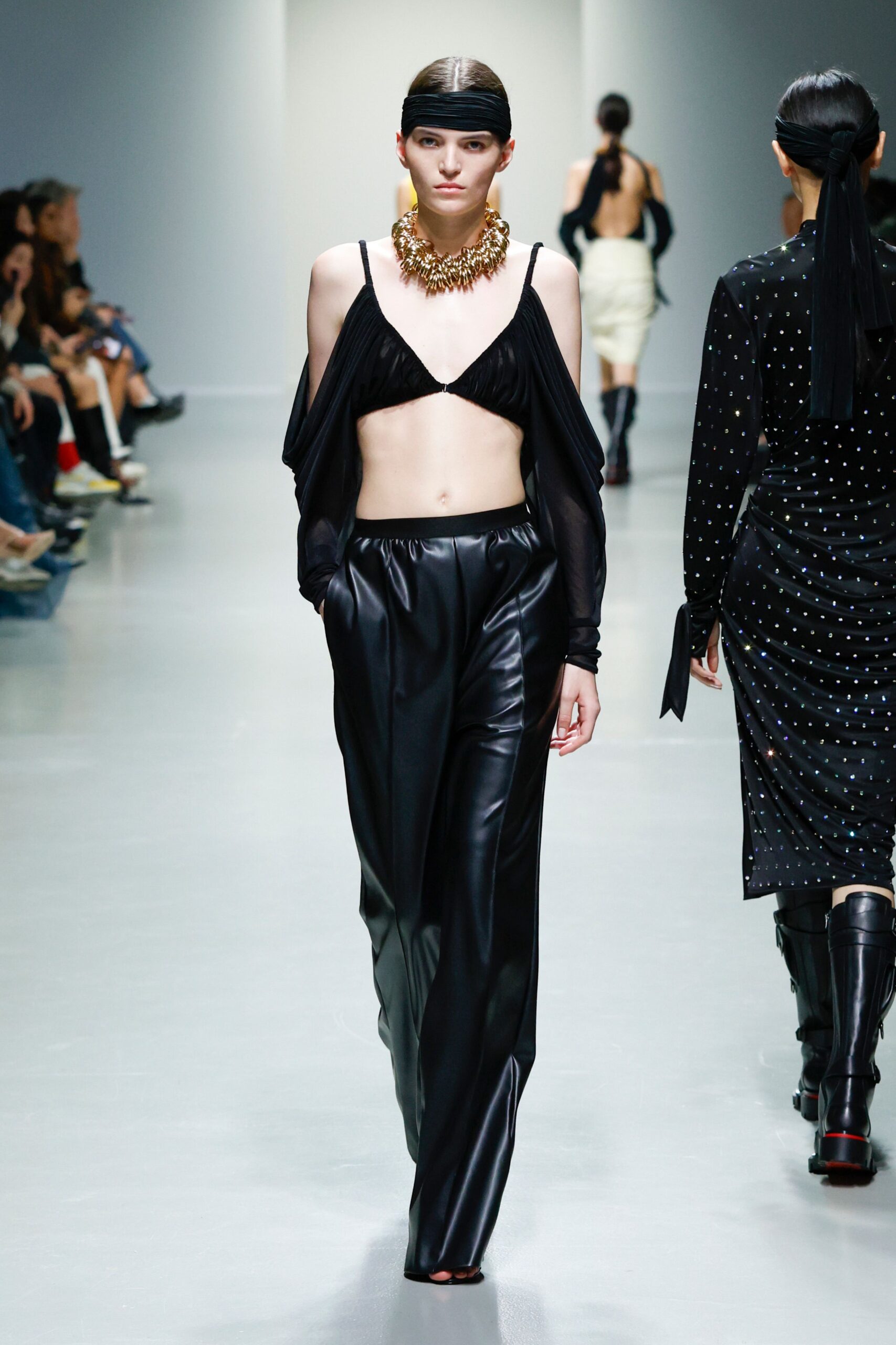black silk top with draped pants