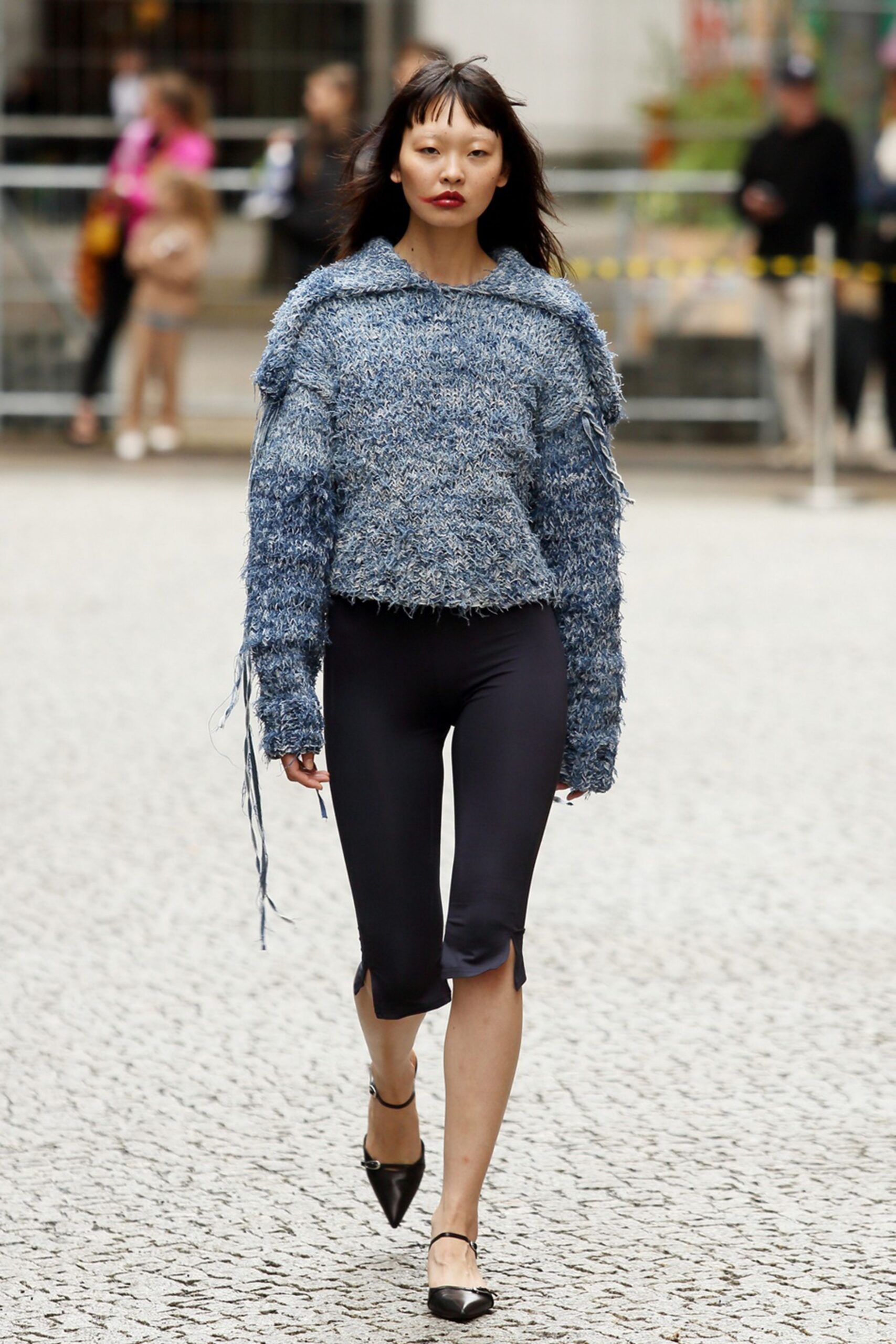 blue cropped sweater with black pants