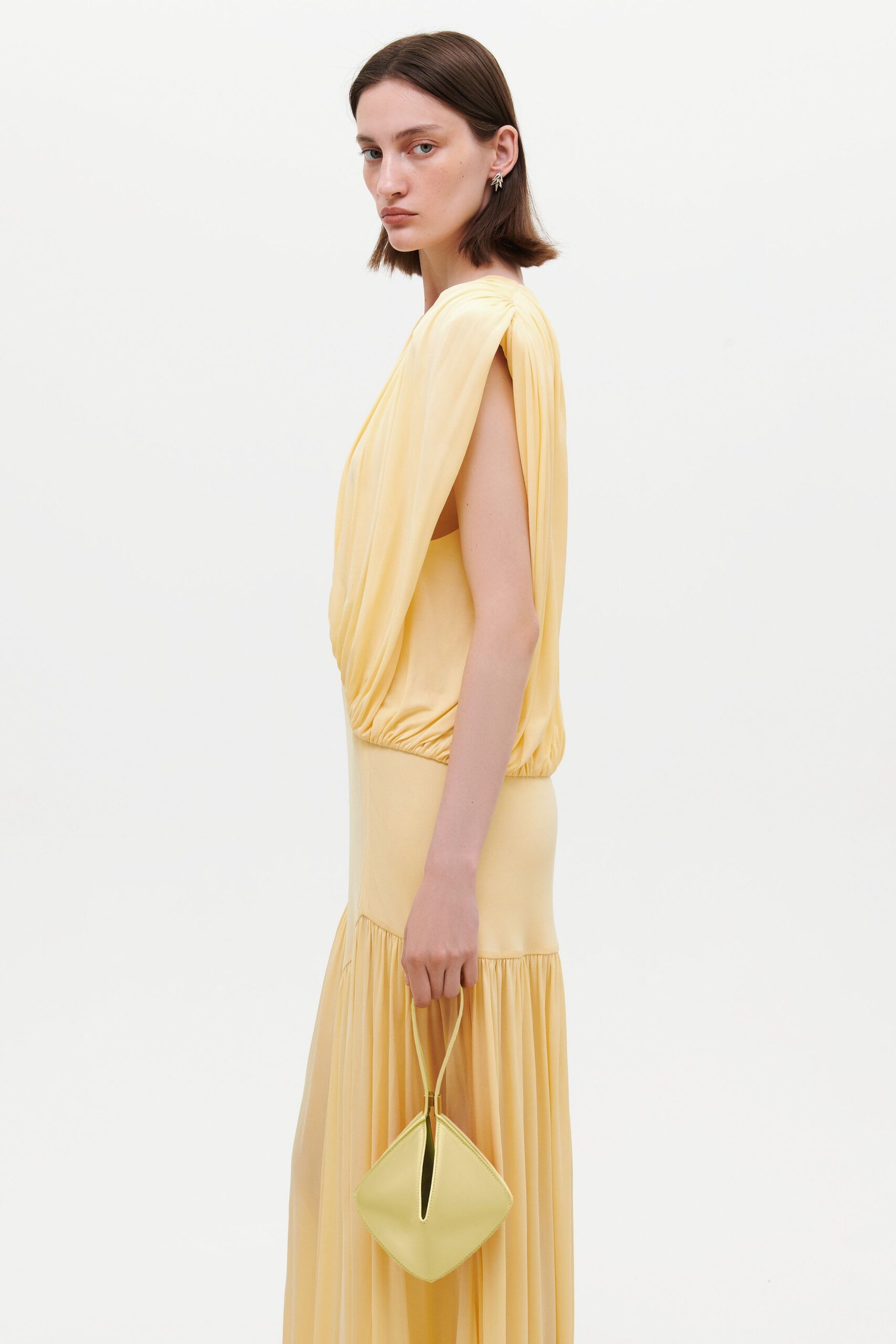 yellow silk sleeveless v-neck fitted pleated flowing dress
