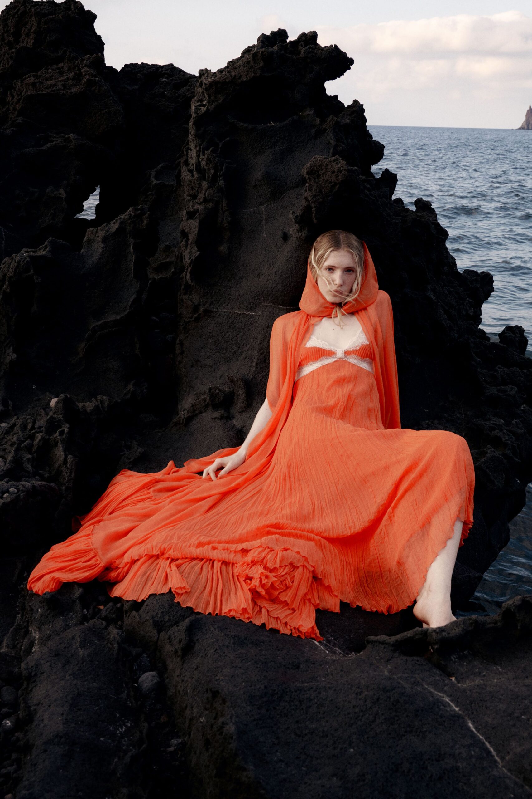 orange flowing chiffon gown