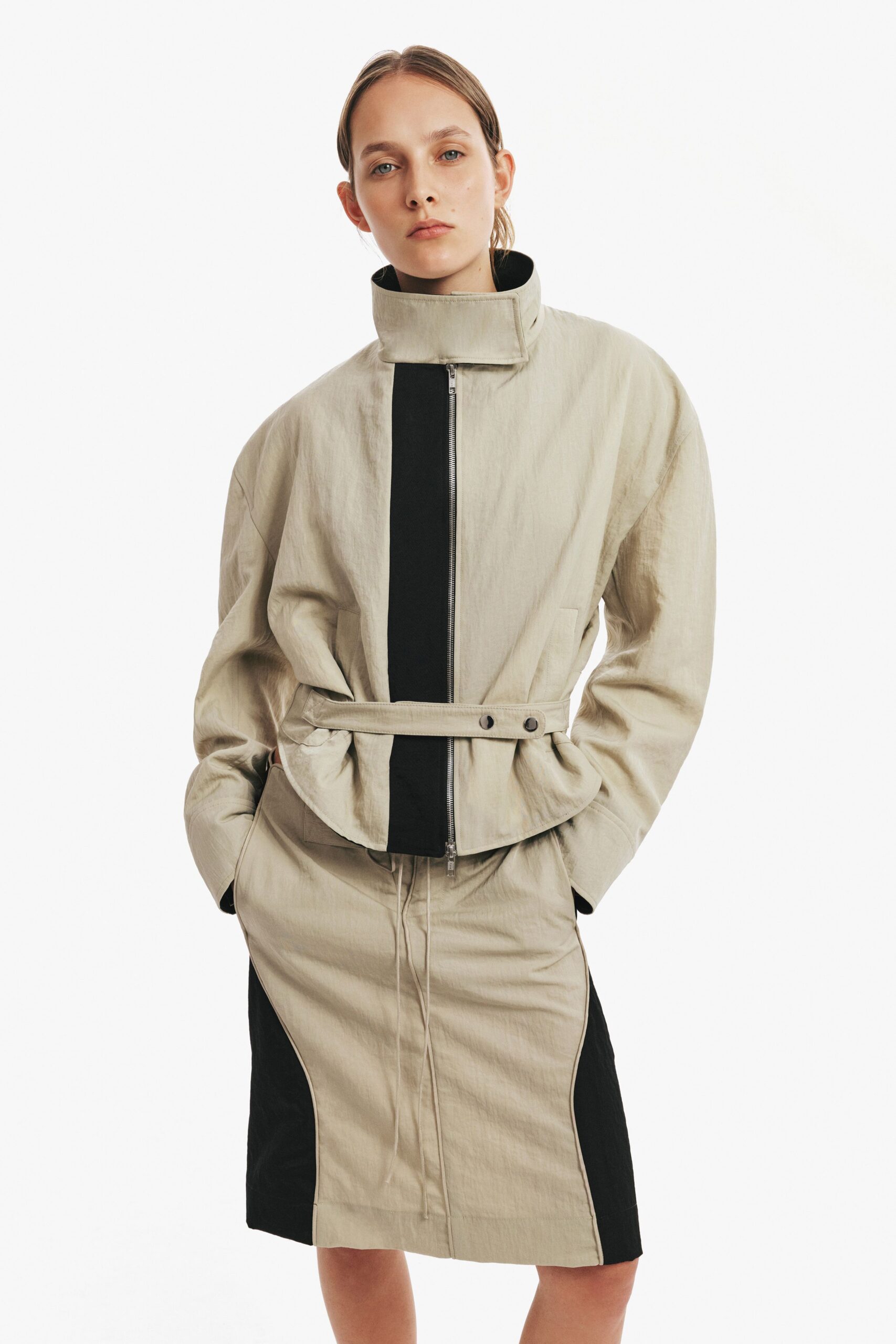 beige and black relaxed jacket with fitted pencil skirt