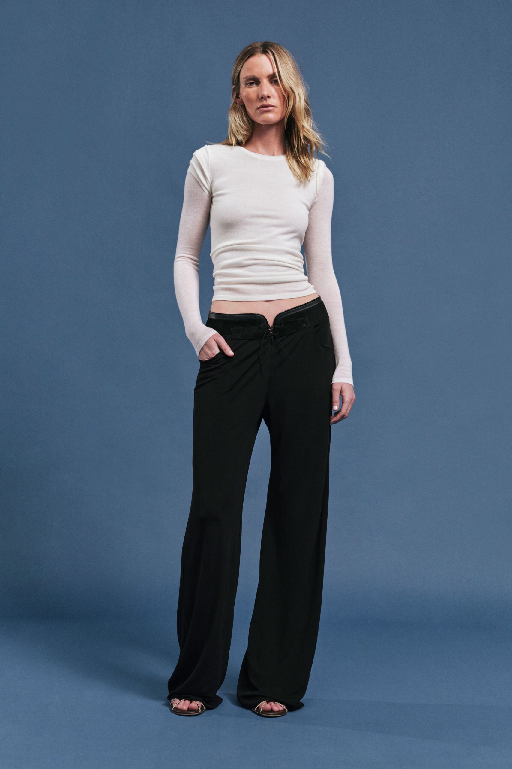 white fitted top black relaxed pants