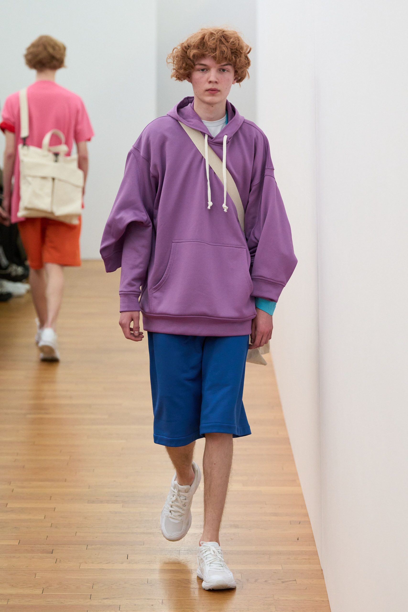 purple oversized hoodie with blue shorts