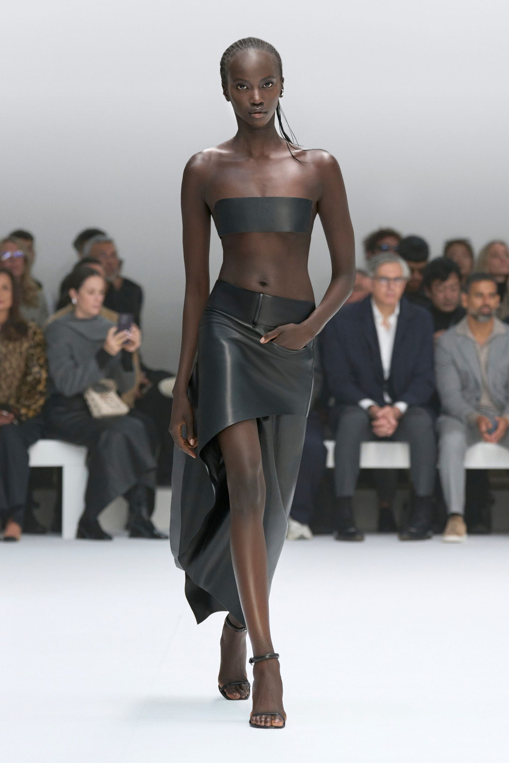 black leather crop-top and skirt