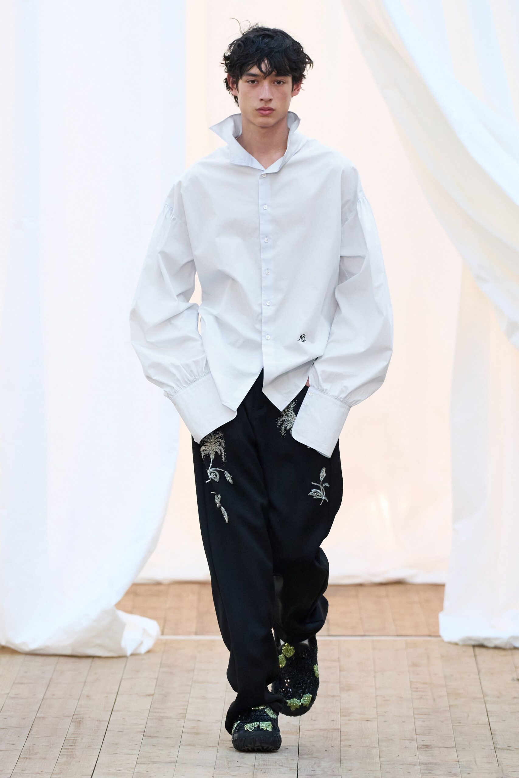 white relaxed shirt with black pants