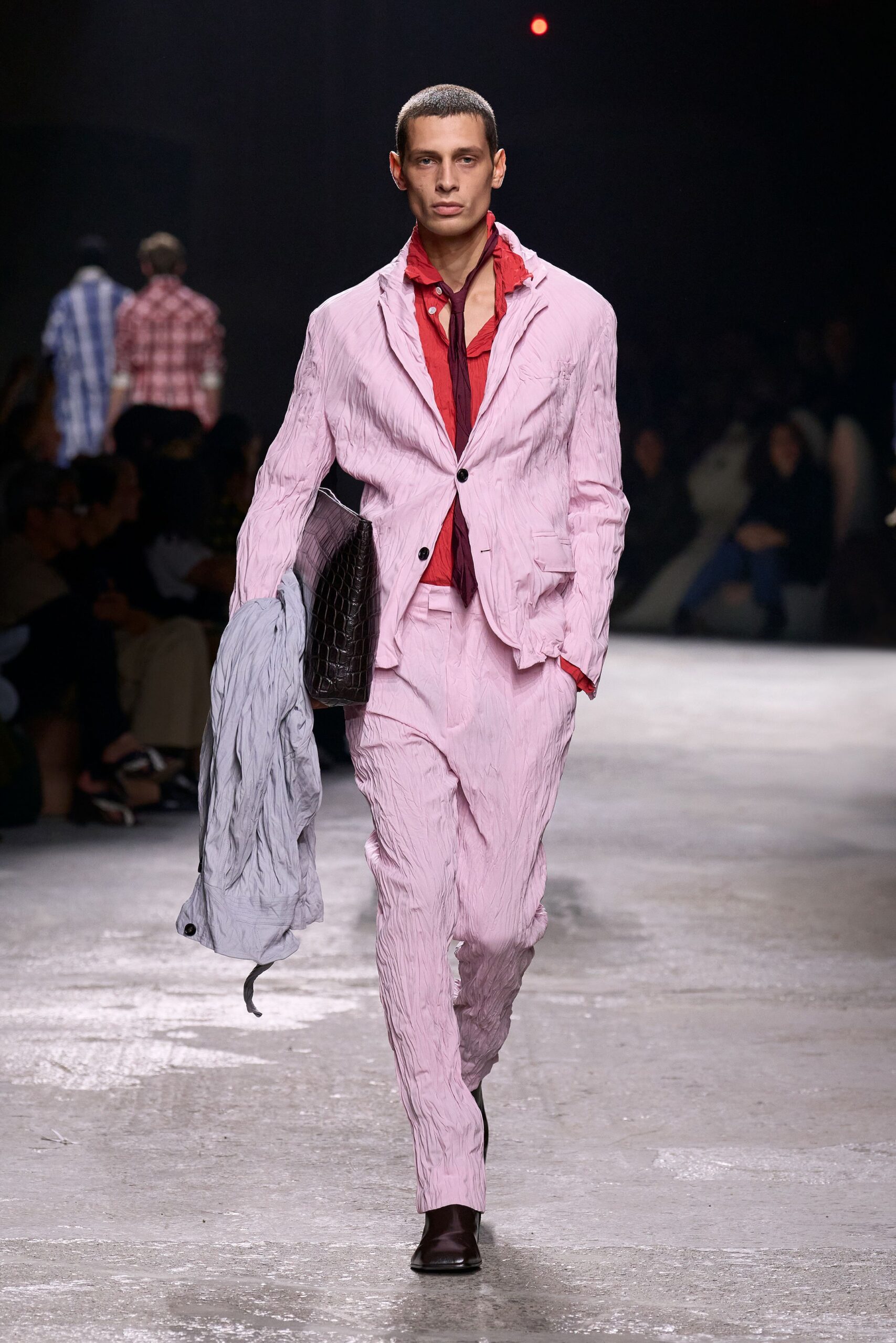 pink fitted suit with red shirt