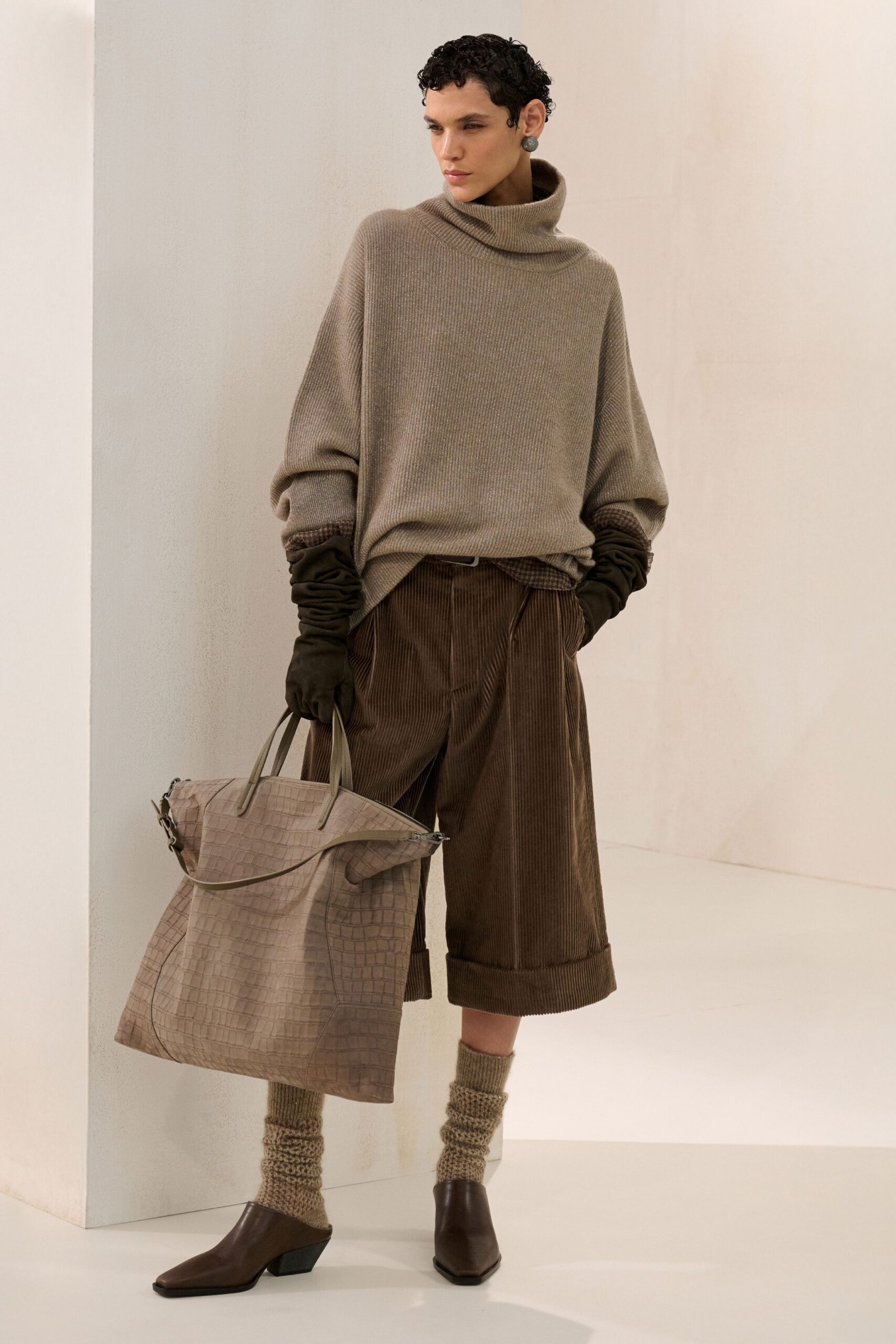beige wool relaxed sweater with brown shorts