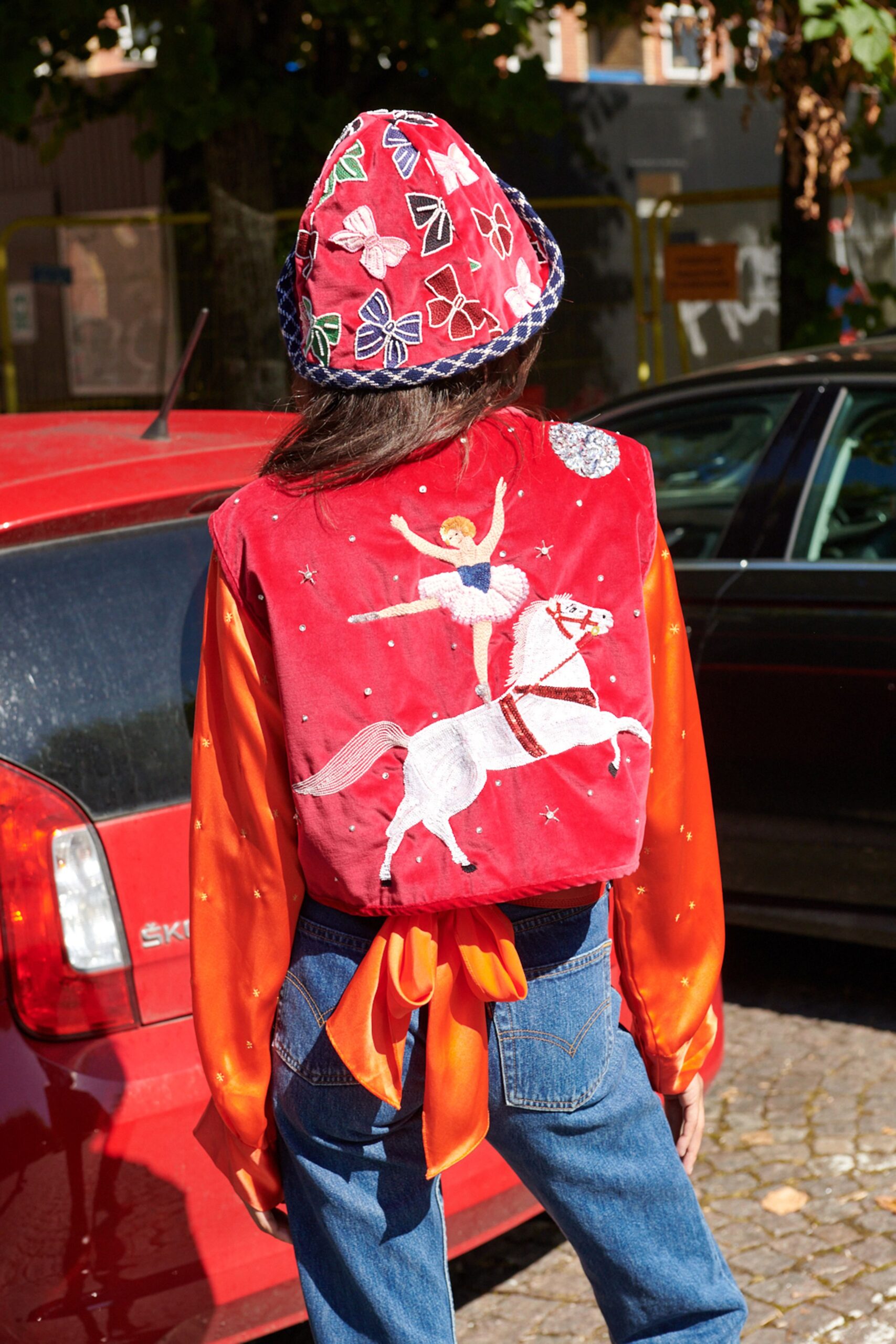 red velvet jacket with embroidered hat