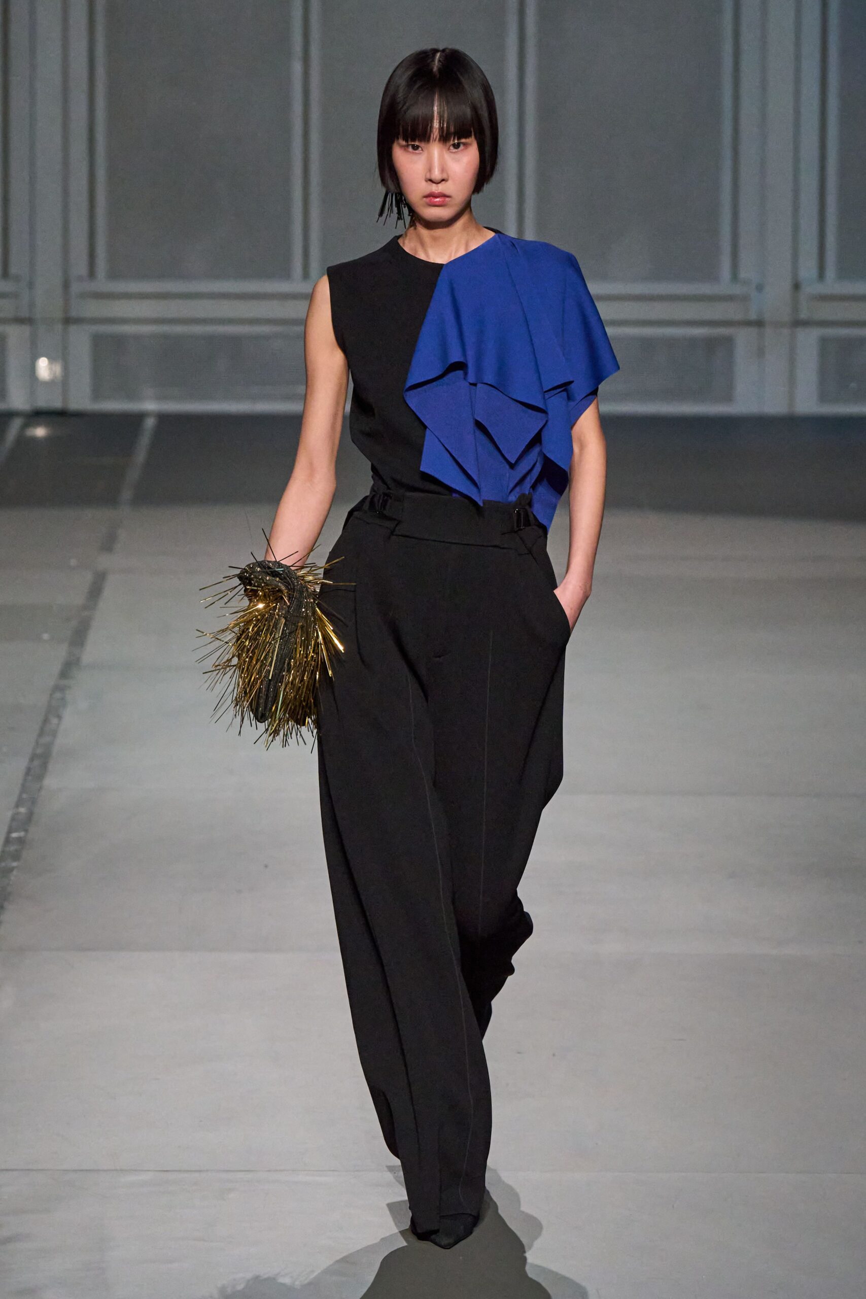 black and blue draped top with relaxed pants
