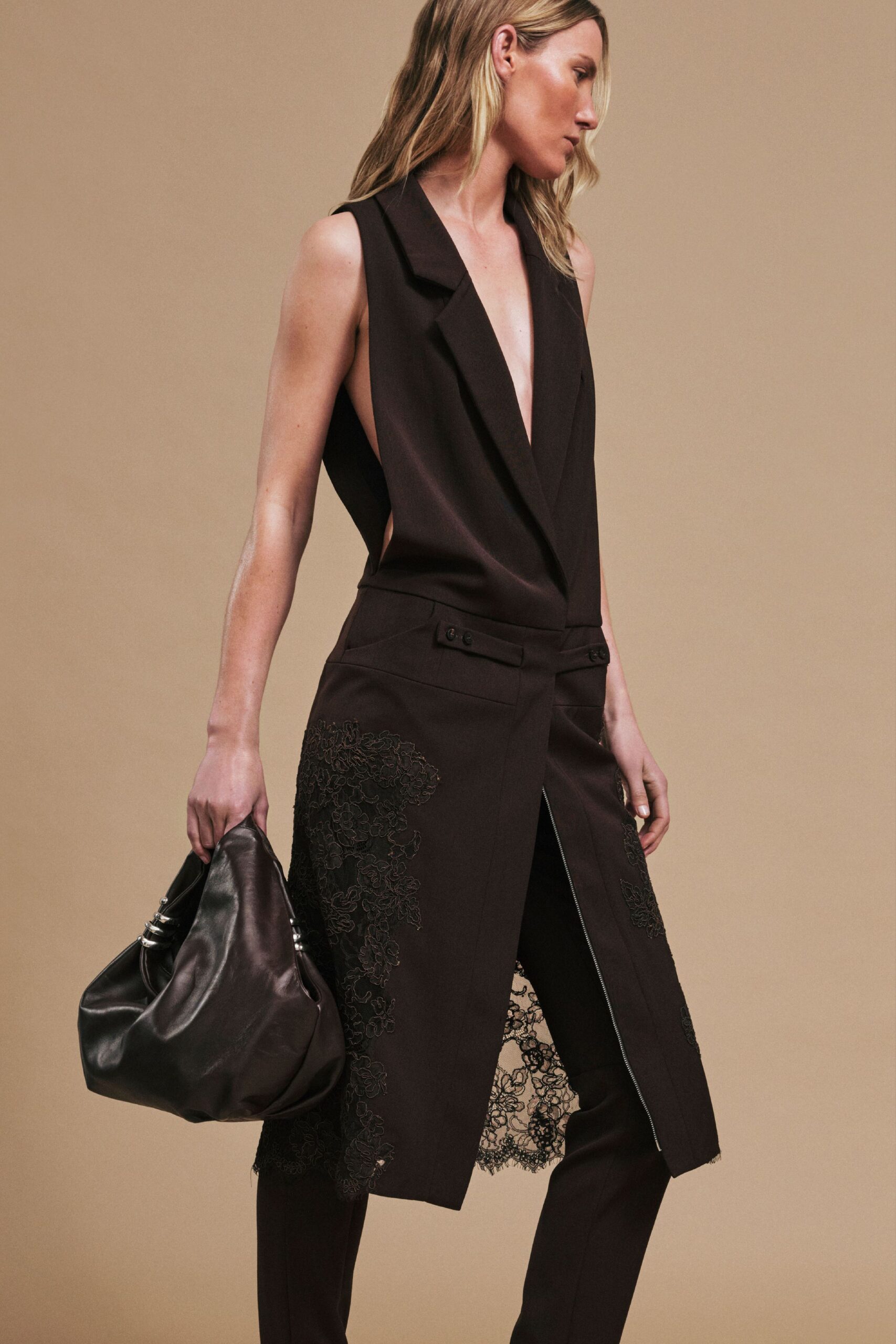 black fitted sleeveless jumpsuit with bag