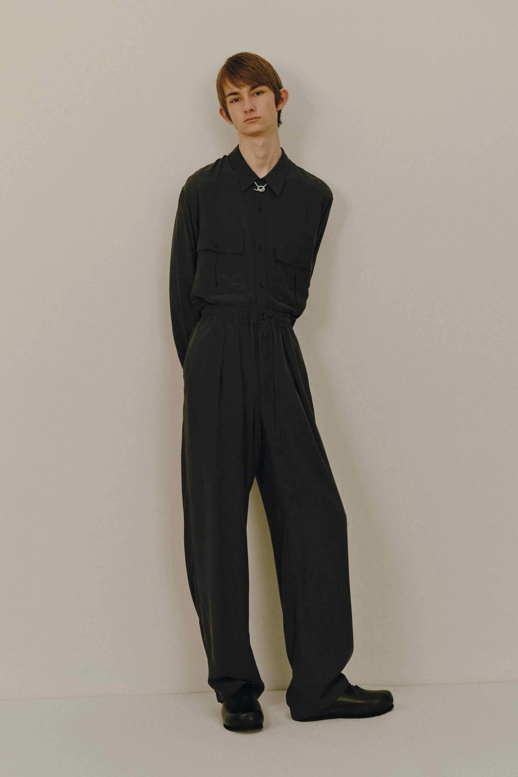 black relaxed jumpsuit with shoes