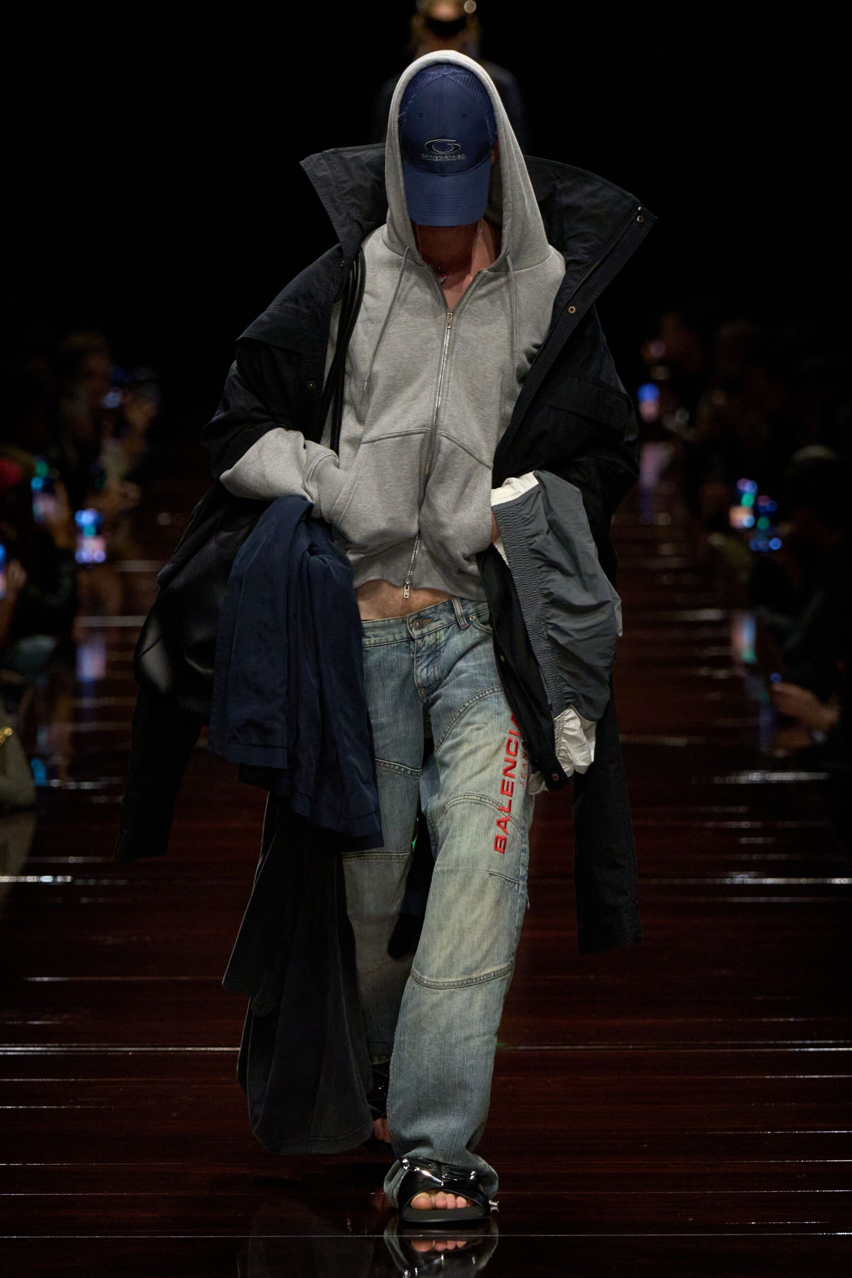 gray hoodie black coat denim pants