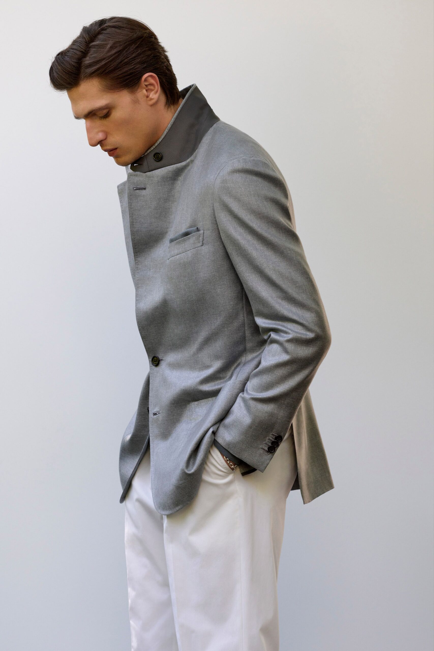 gray tailored blazer with white pants