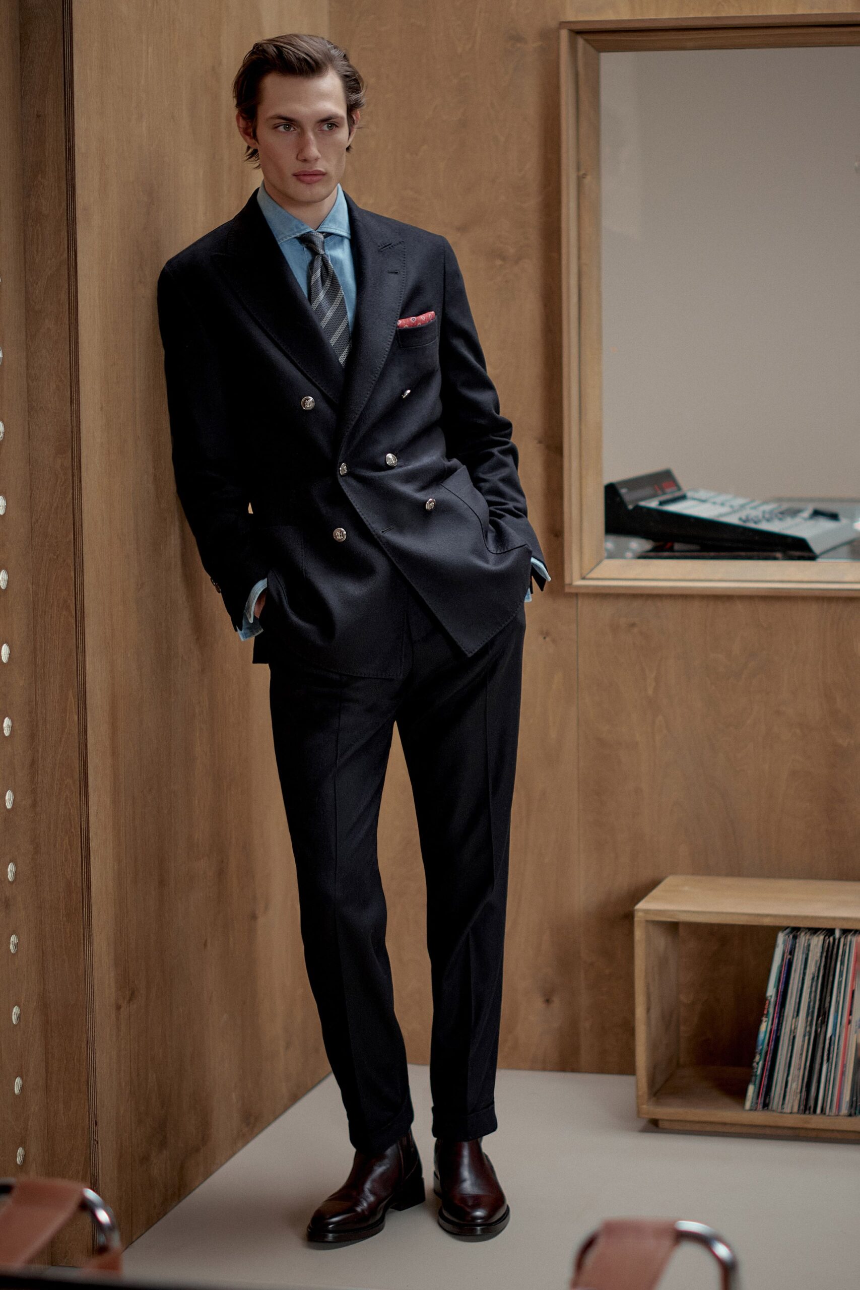 black tailored suit with blue shirt