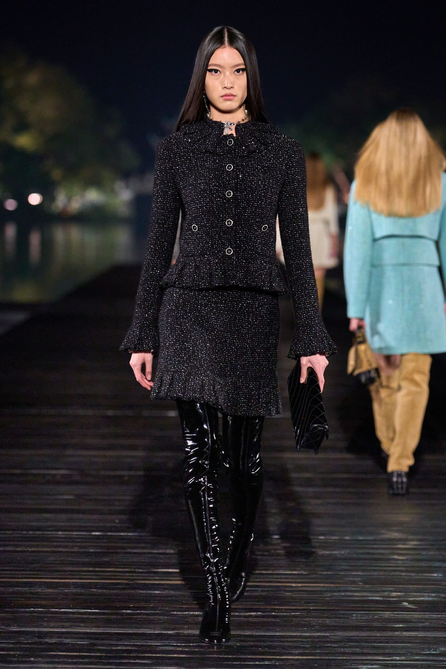 black fitted jacket and mini skirt