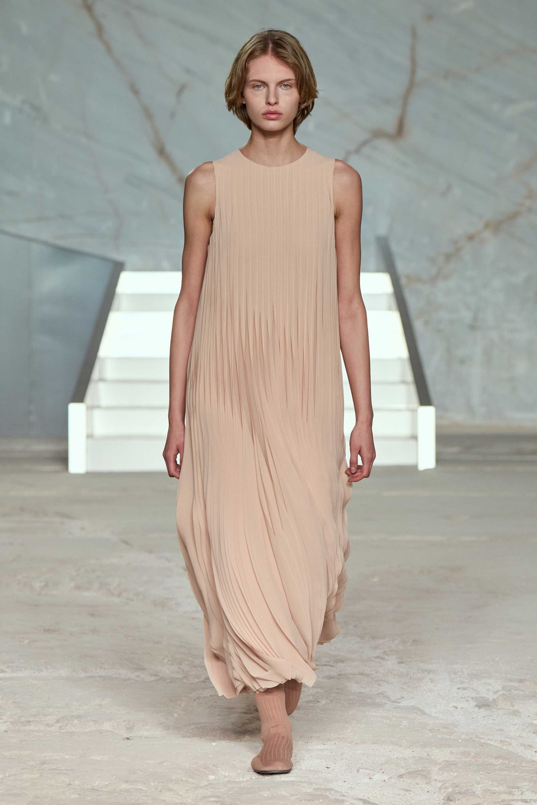 beige silk sleeveless high-neck relaxed pleated flowing dress