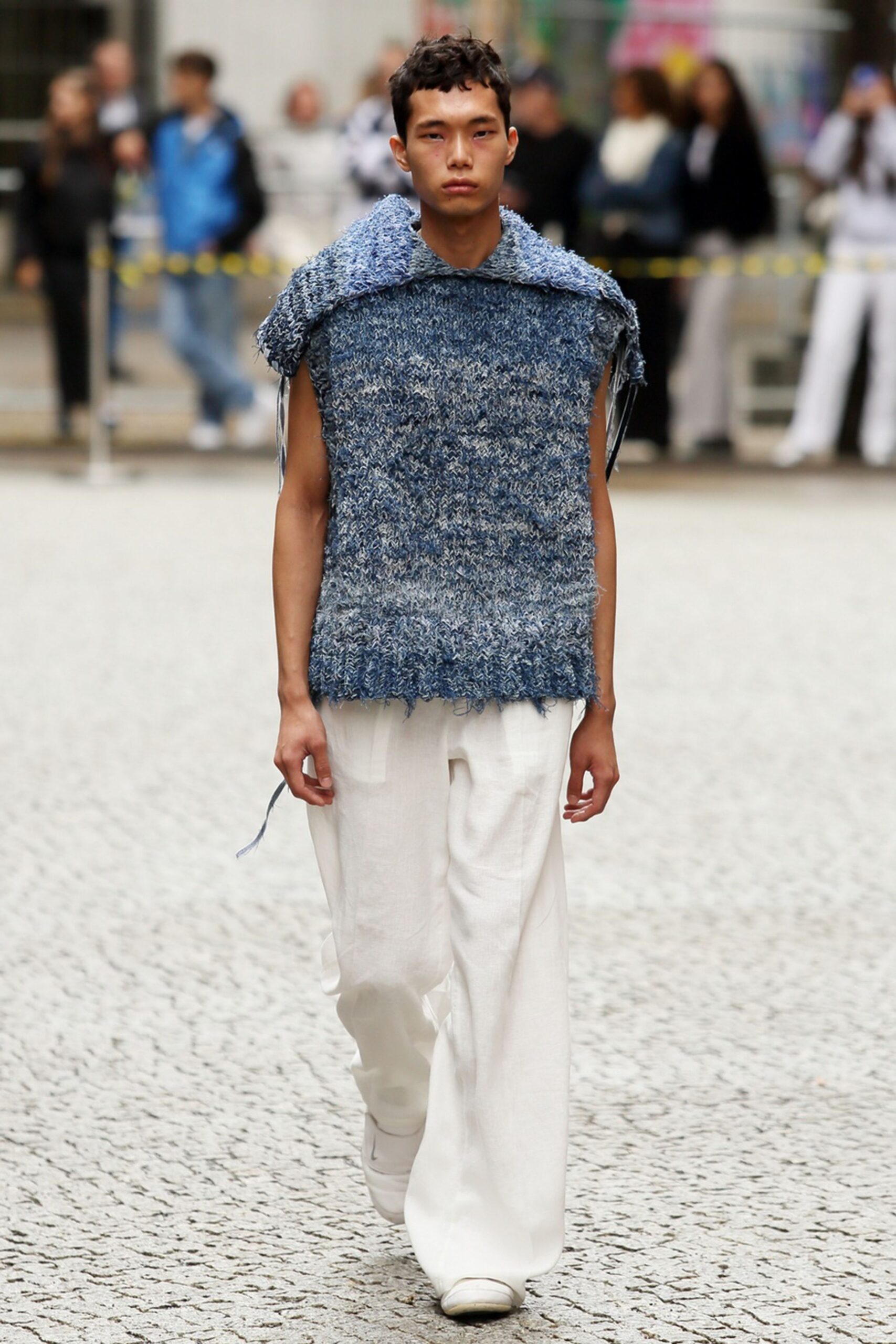 blue relaxed top with white pants