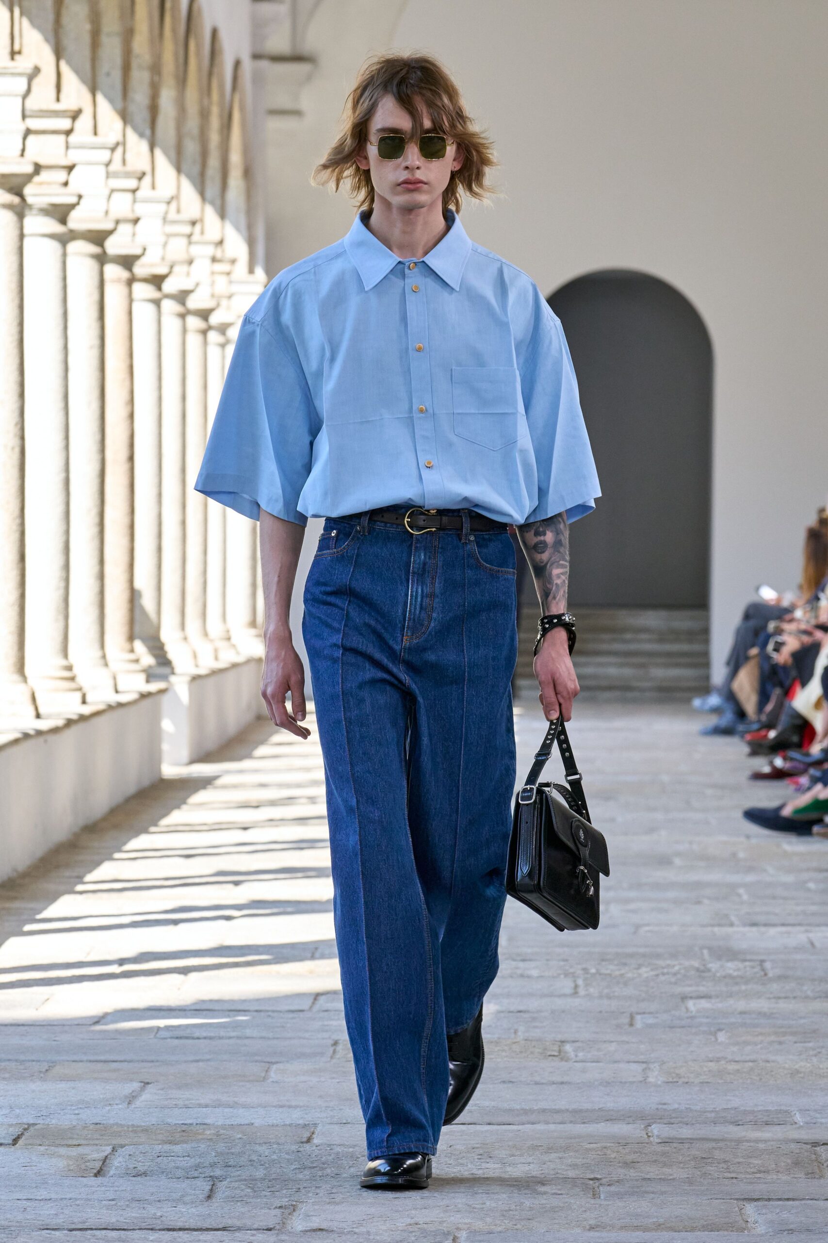 blue relaxed shirt and denim pants