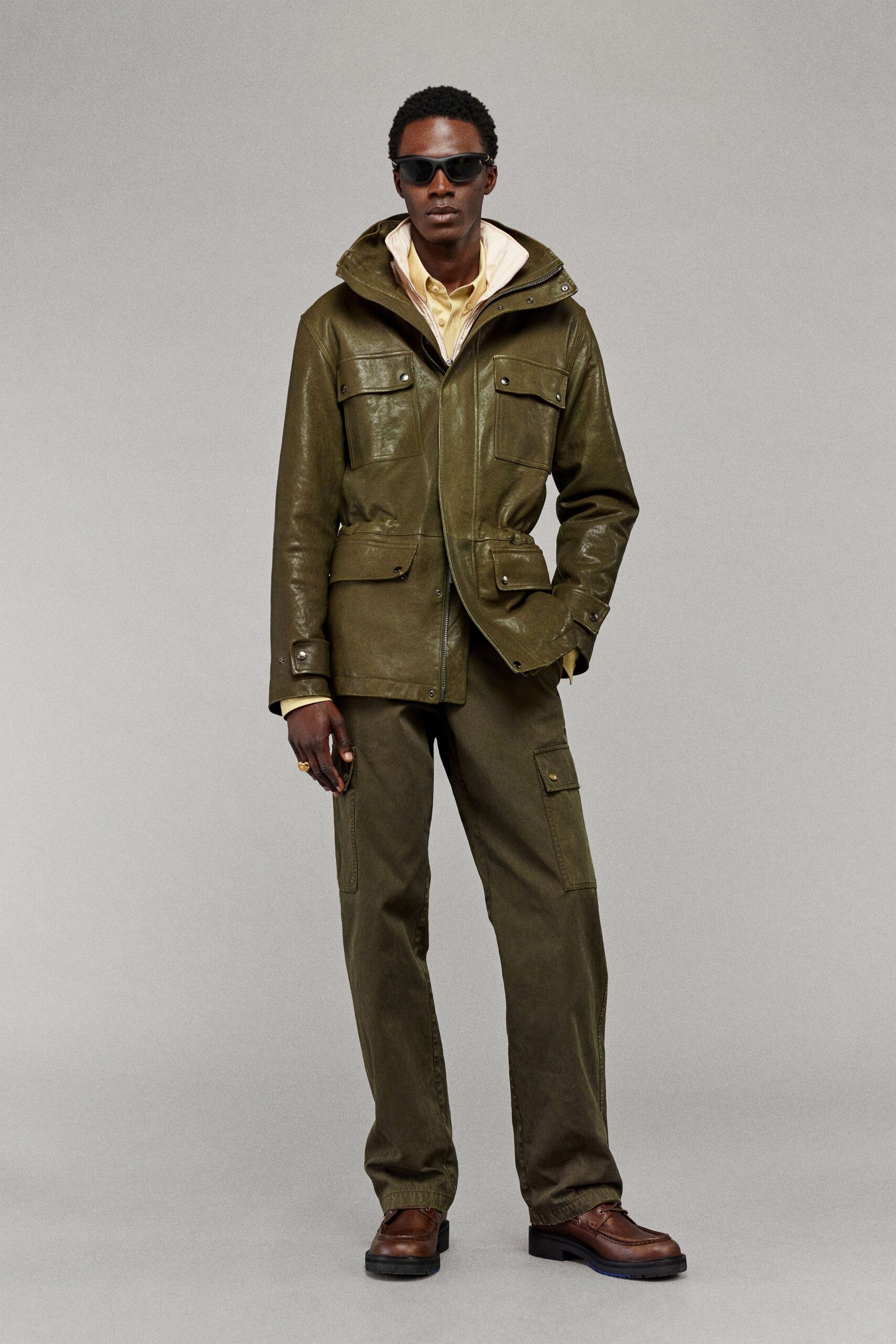 green leather jacket with yellow shirt