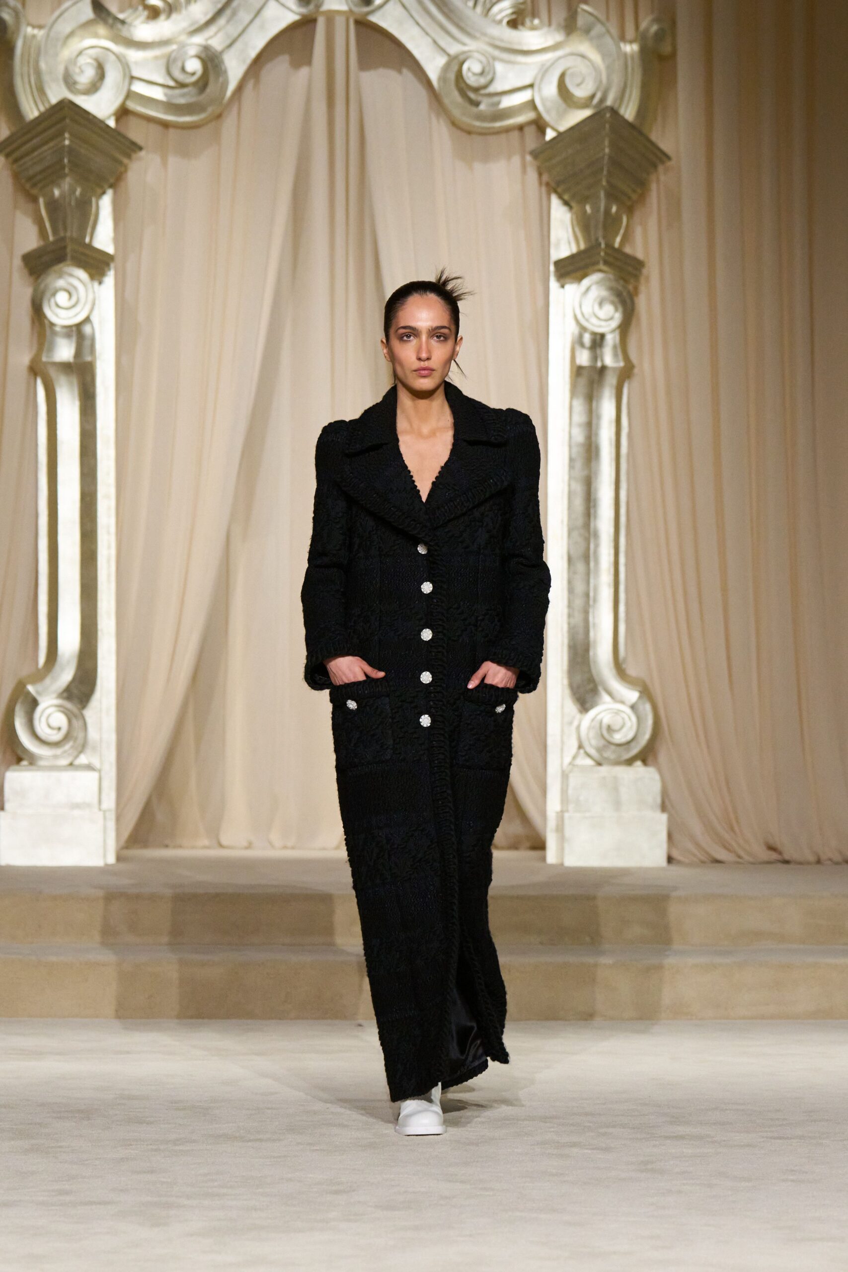black wool relaxed coat with white shoes