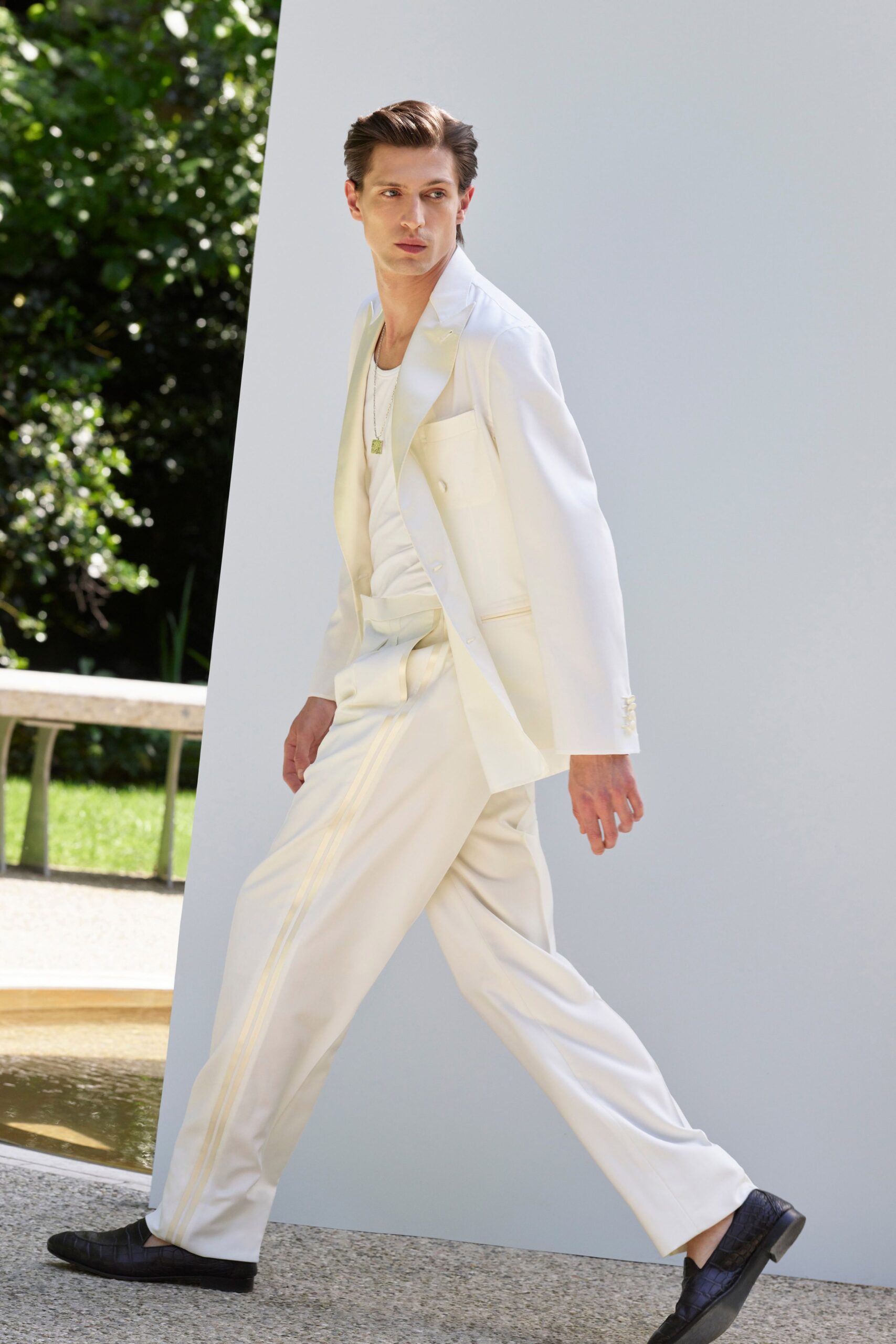 white tailored suit with black shoes
