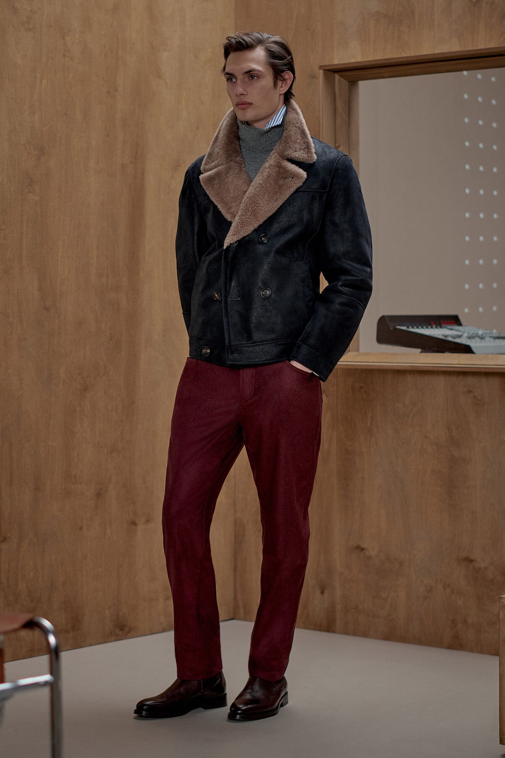 black leather jacket gray sweater red pants