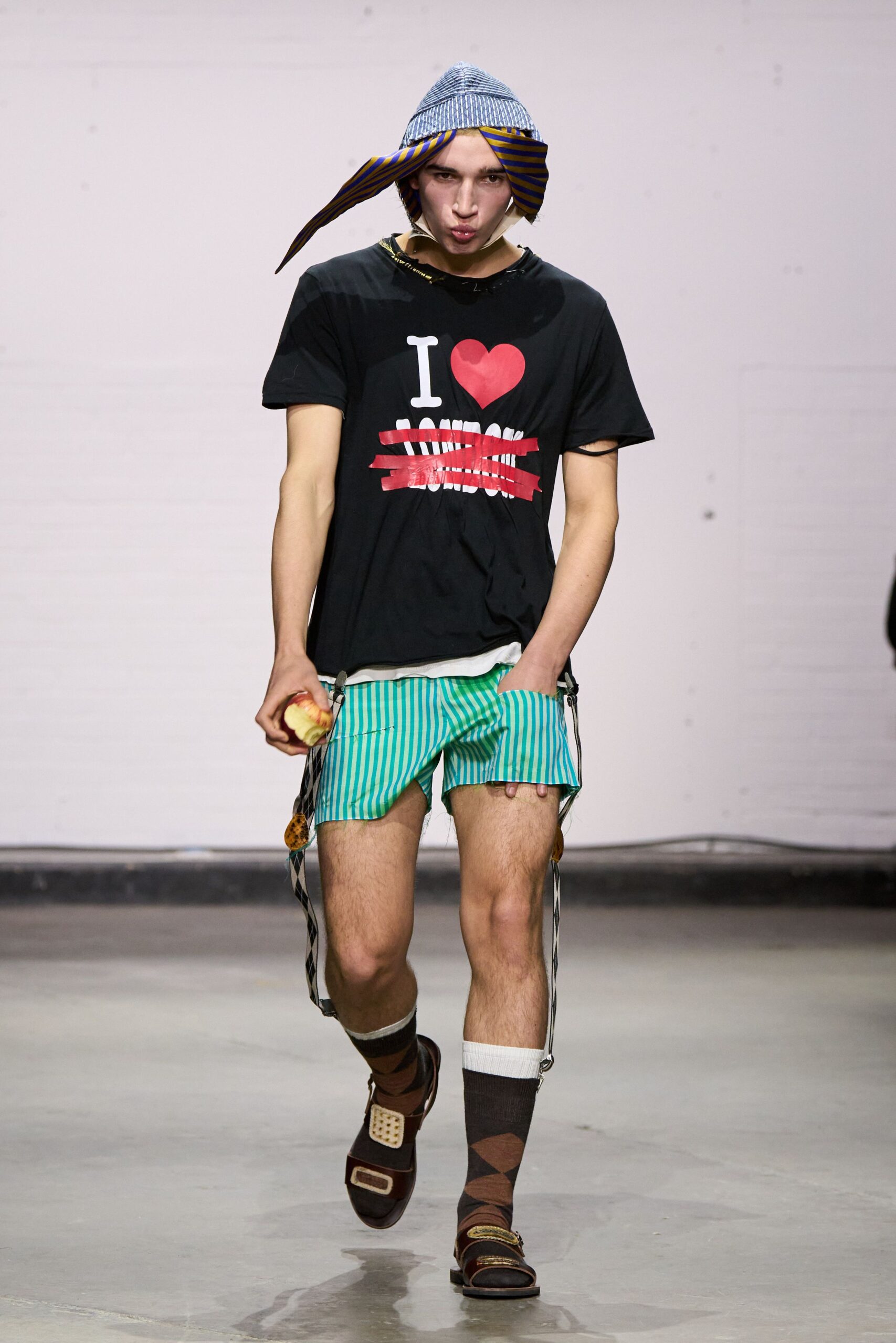 black t-shirt green striped shorts