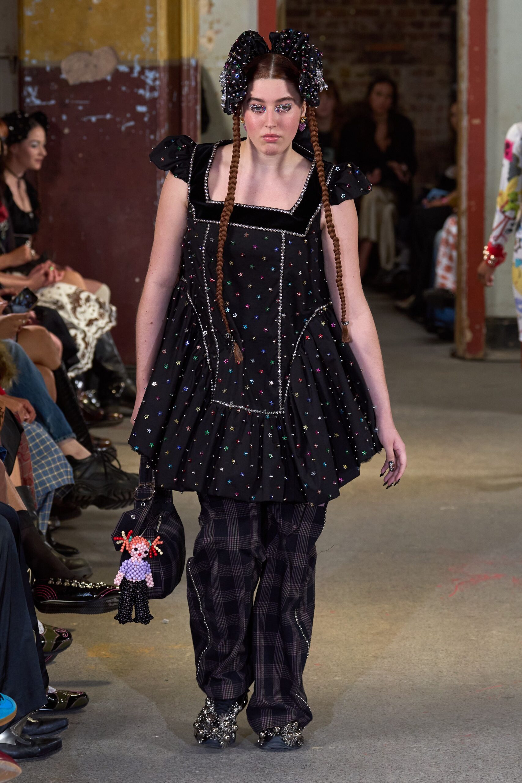 black relaxed top with checked pants
