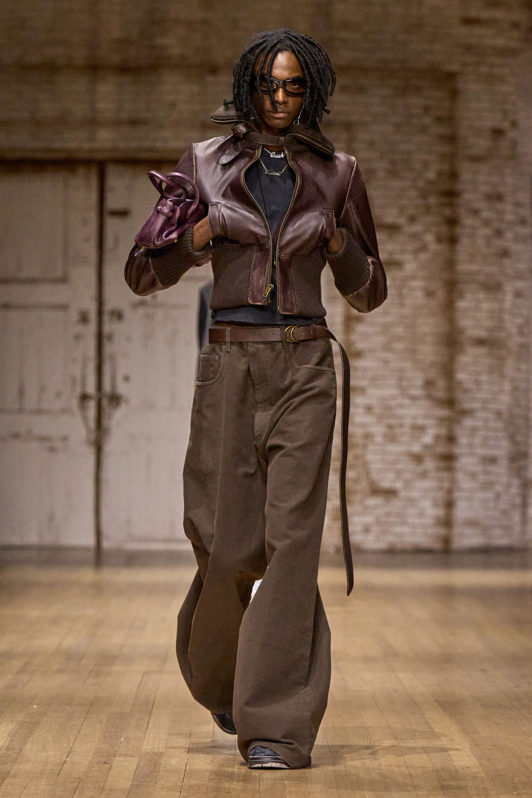 brown leather jacket black top