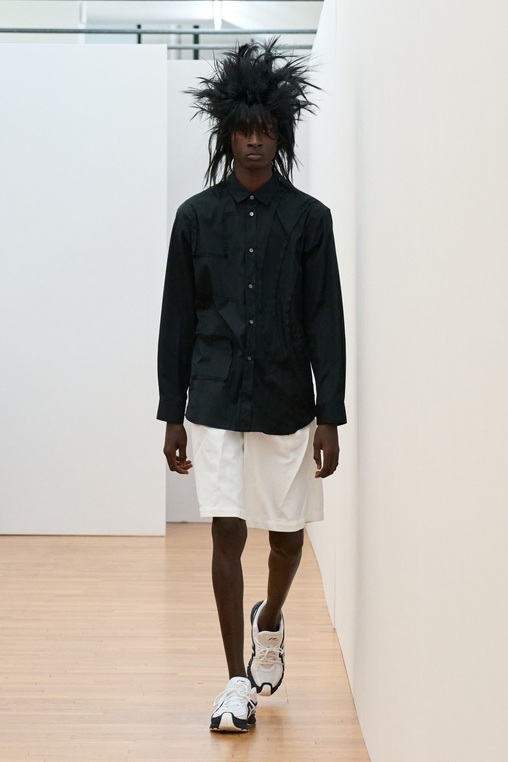 black shirt white shorts sneakers