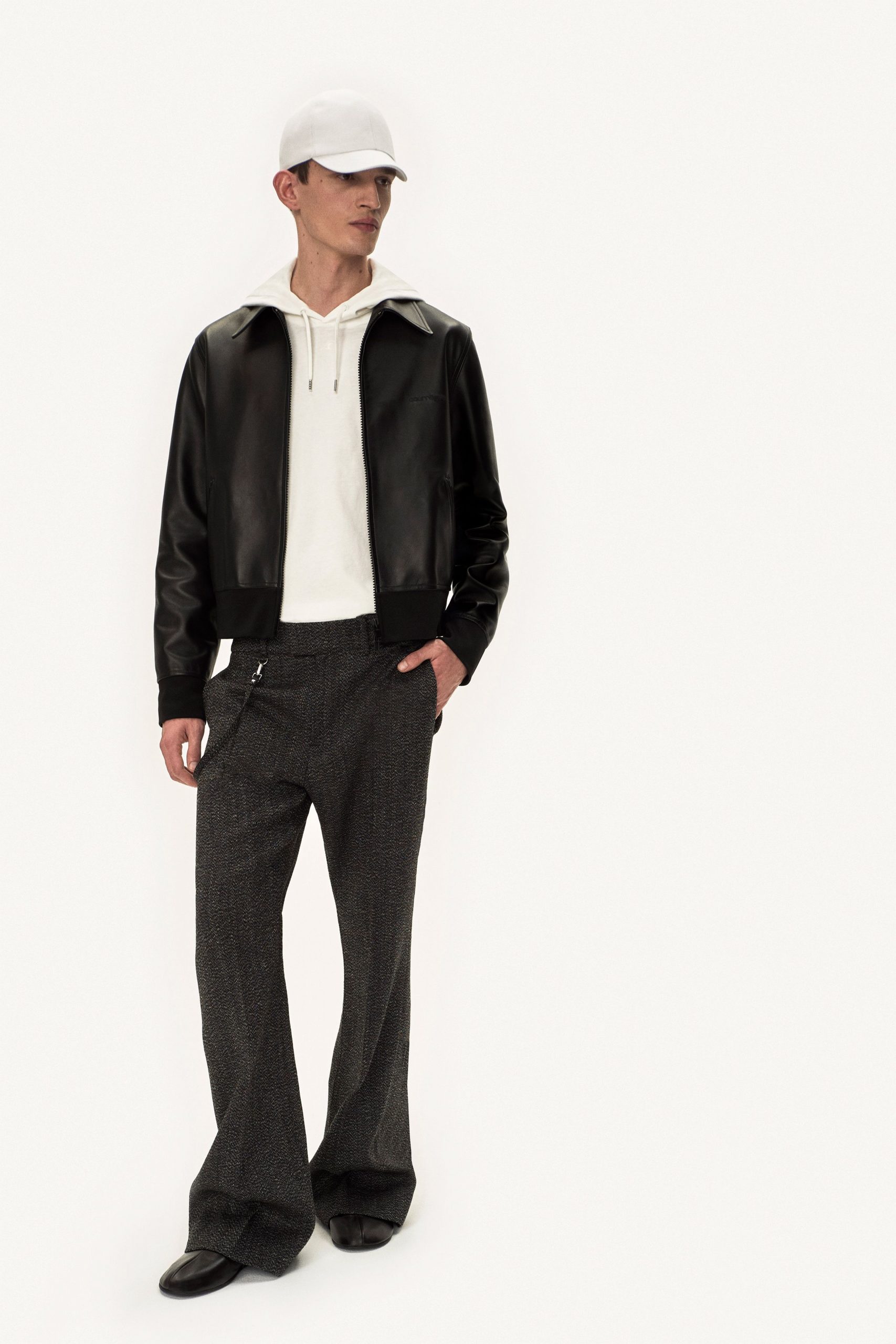 black leather jacket white hoodie gray pants
