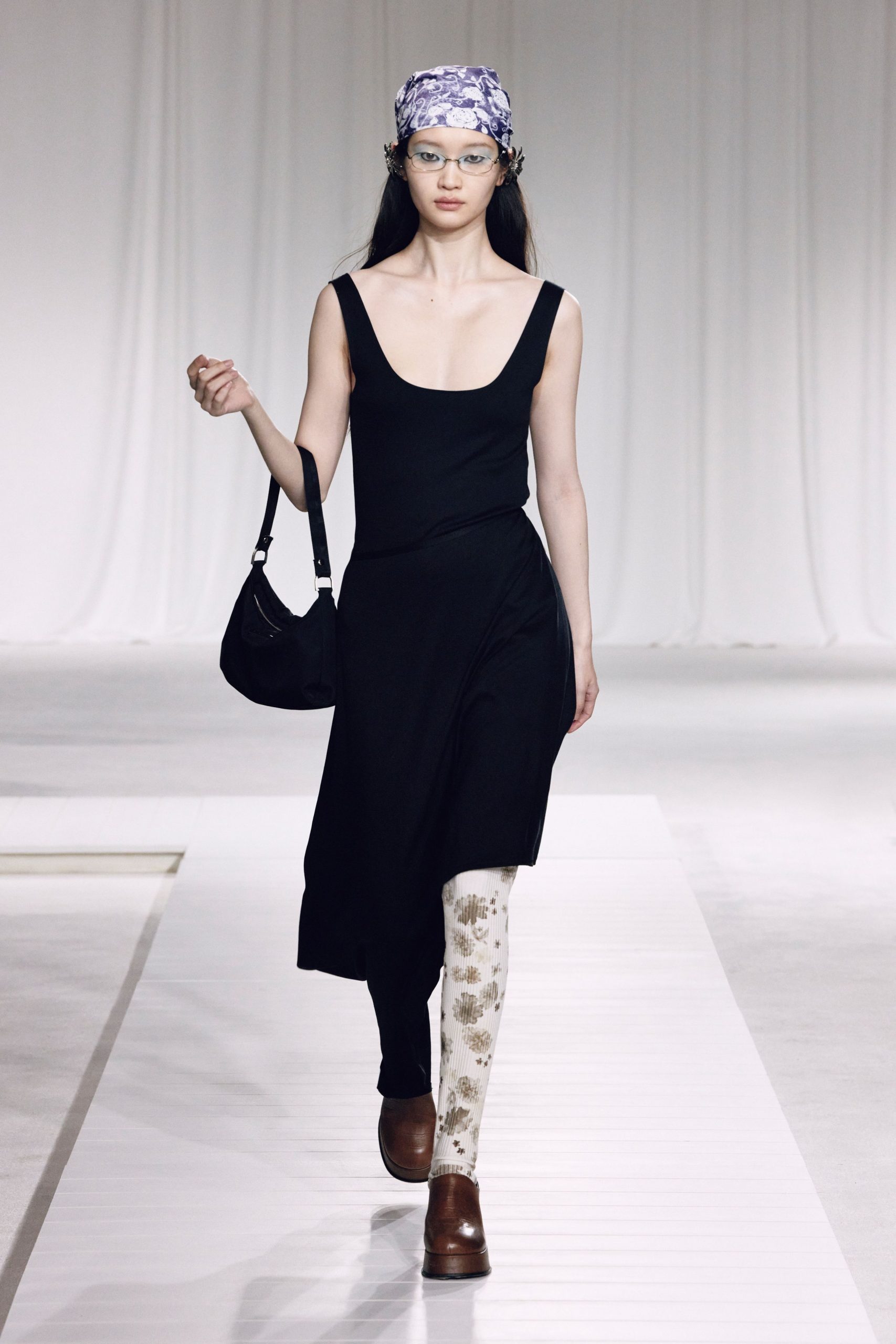 black fitted midi dress with floral leggings