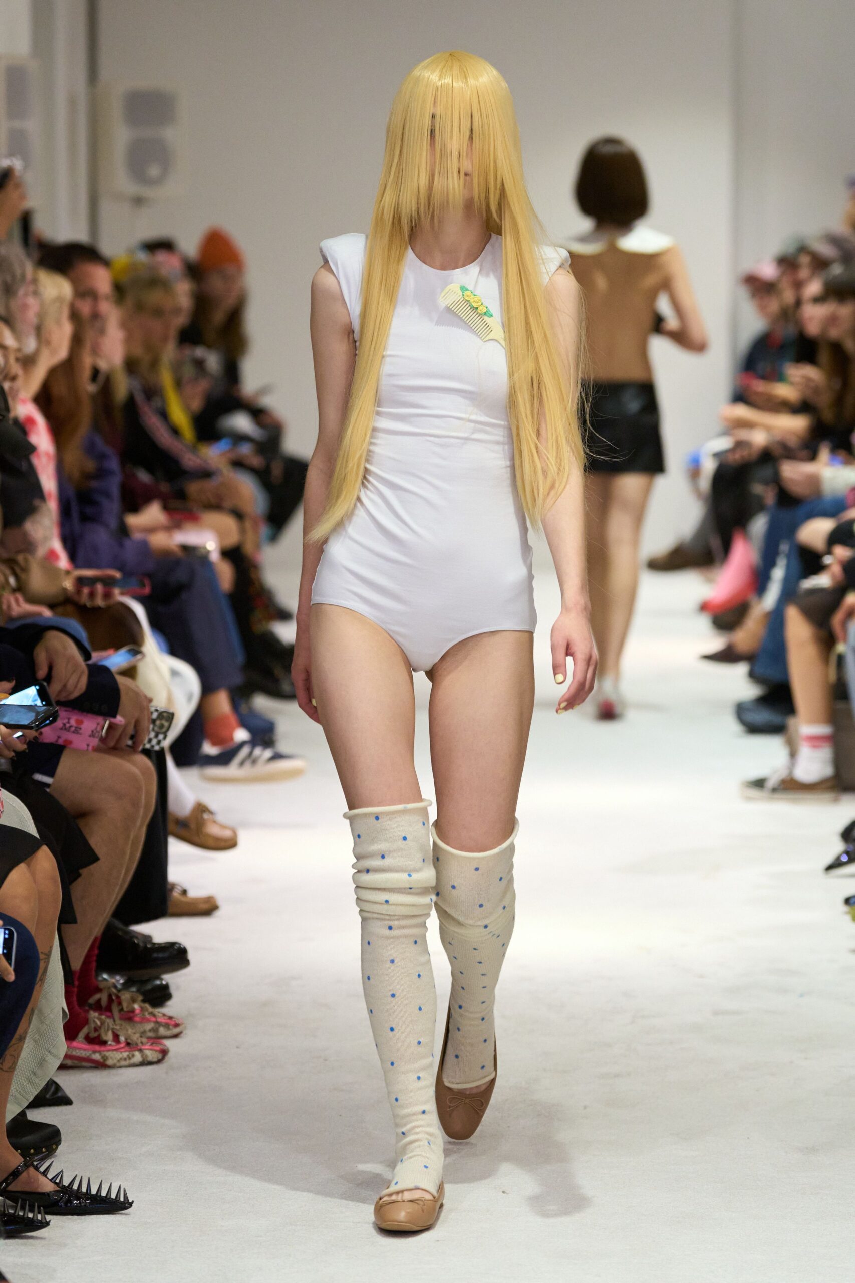 white fitted bodysuit with beige boots