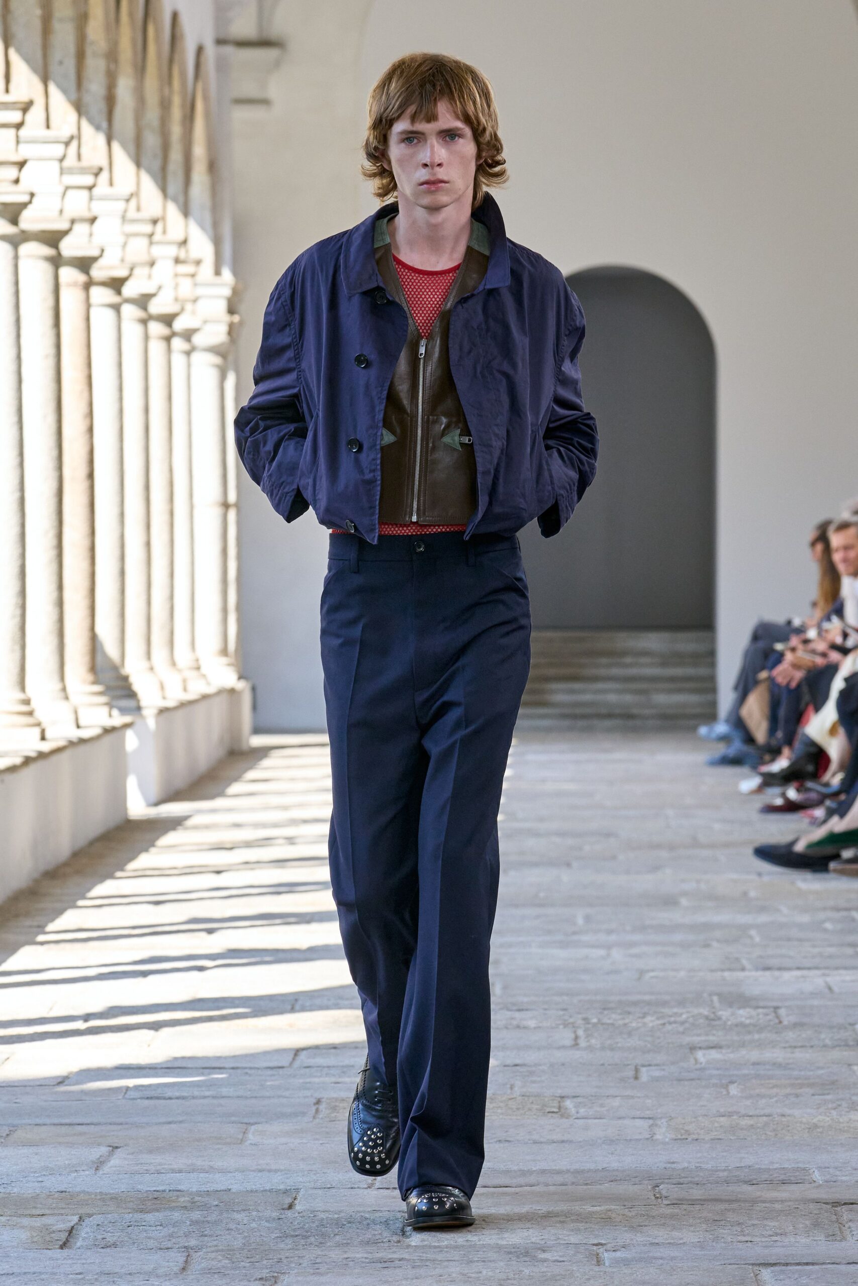 navy jacket red top tailored pants