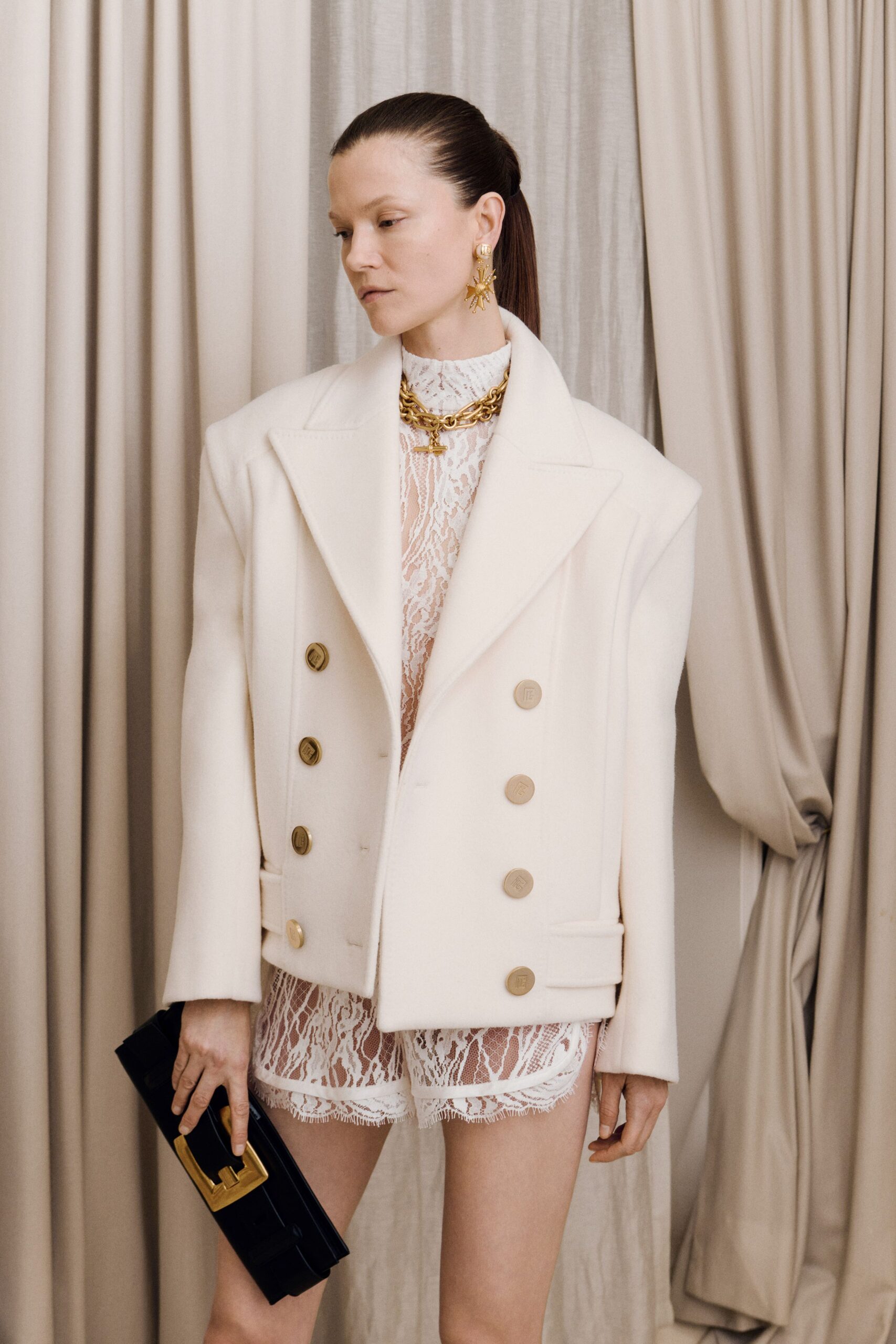 white wool long-sleeve collared structured buttoned jacket