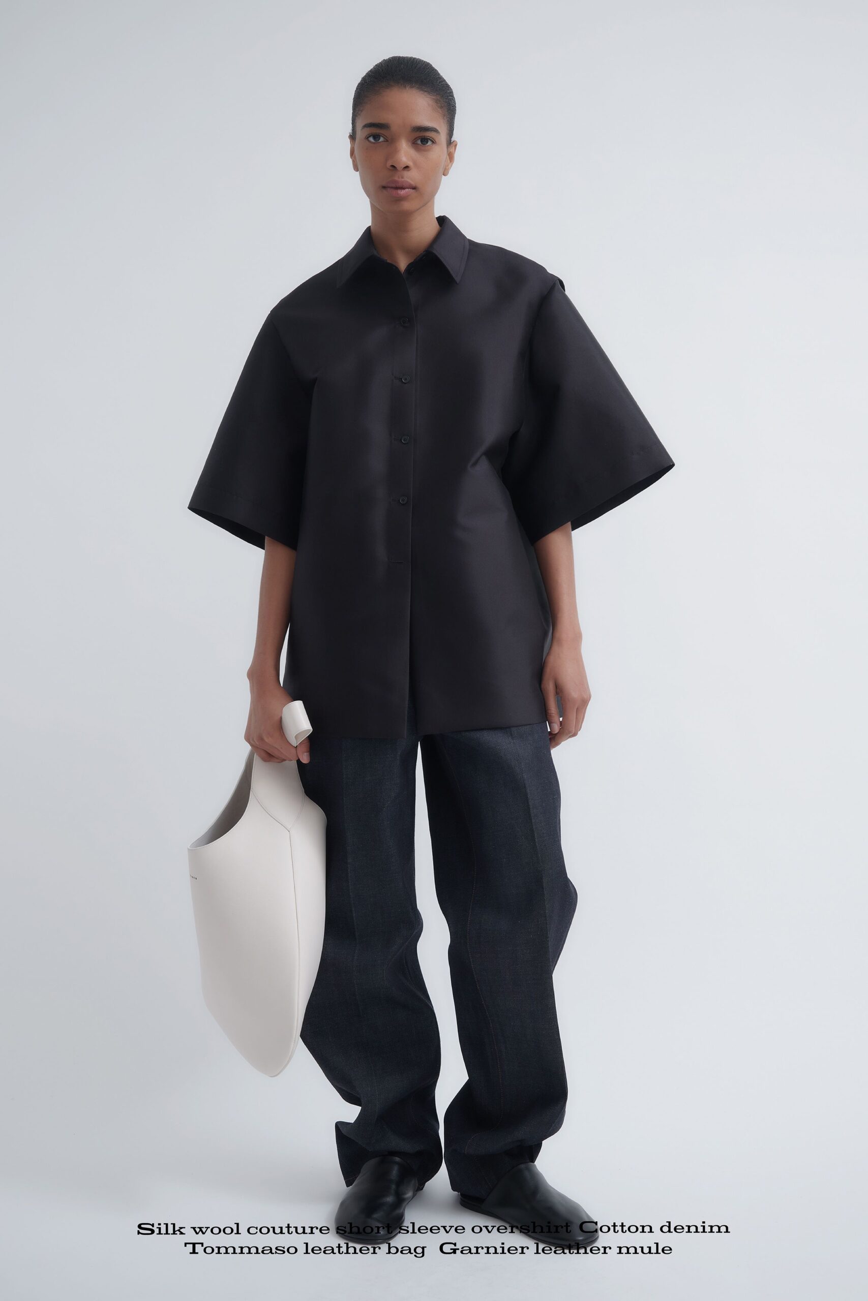 black relaxed shirt with blue pants