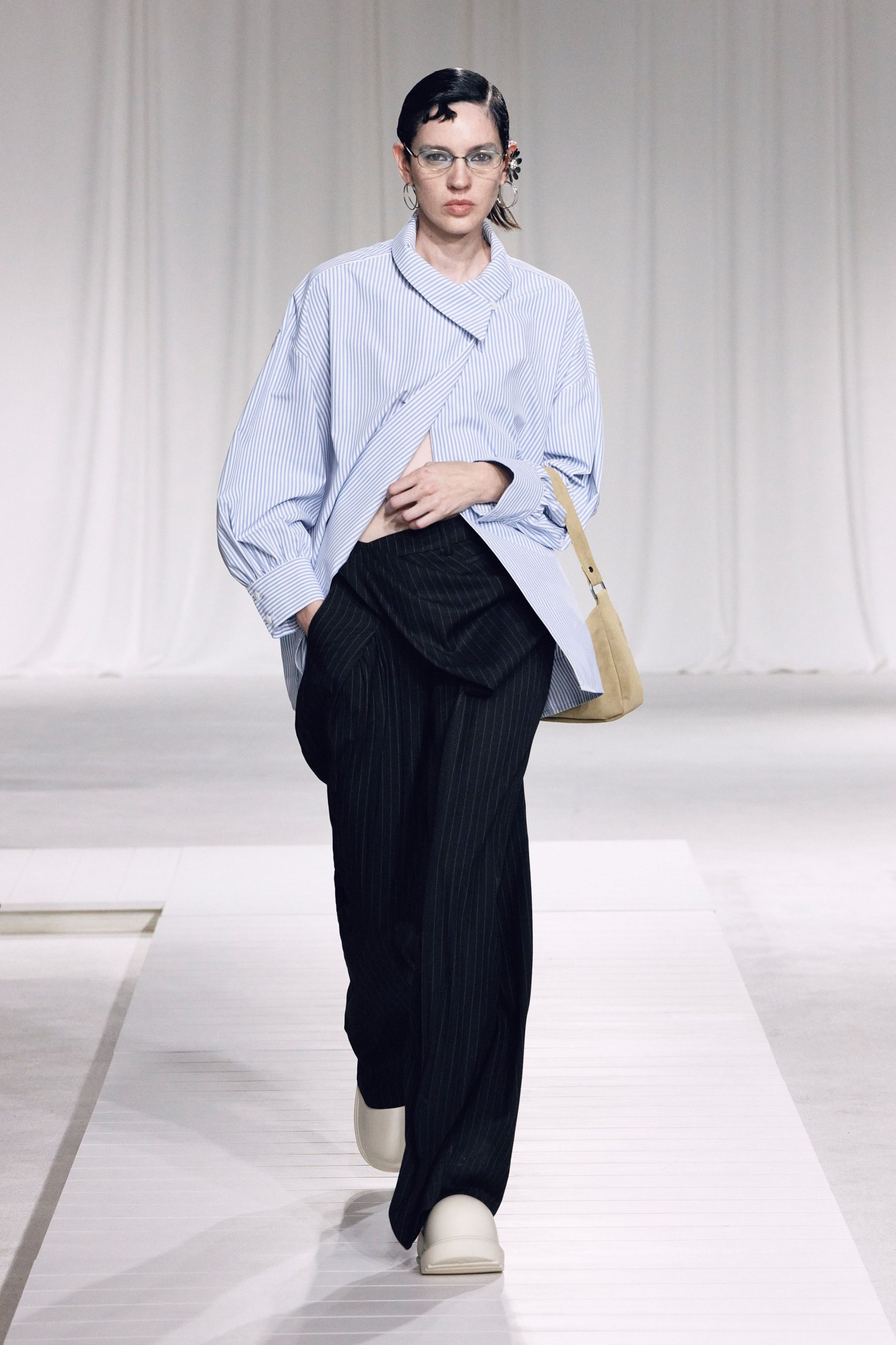 blue and white striped shirt with black pants