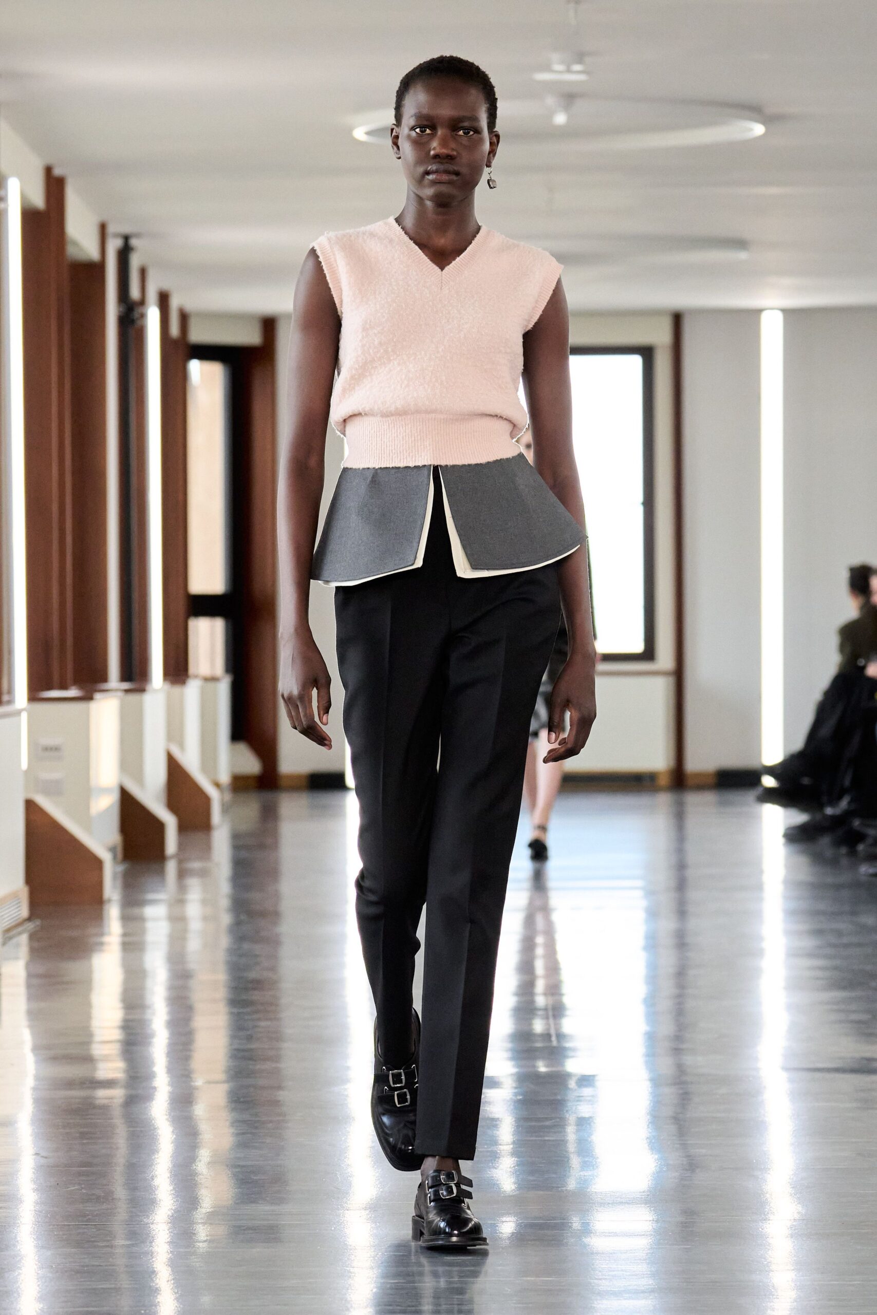 pink fitted top with black pants