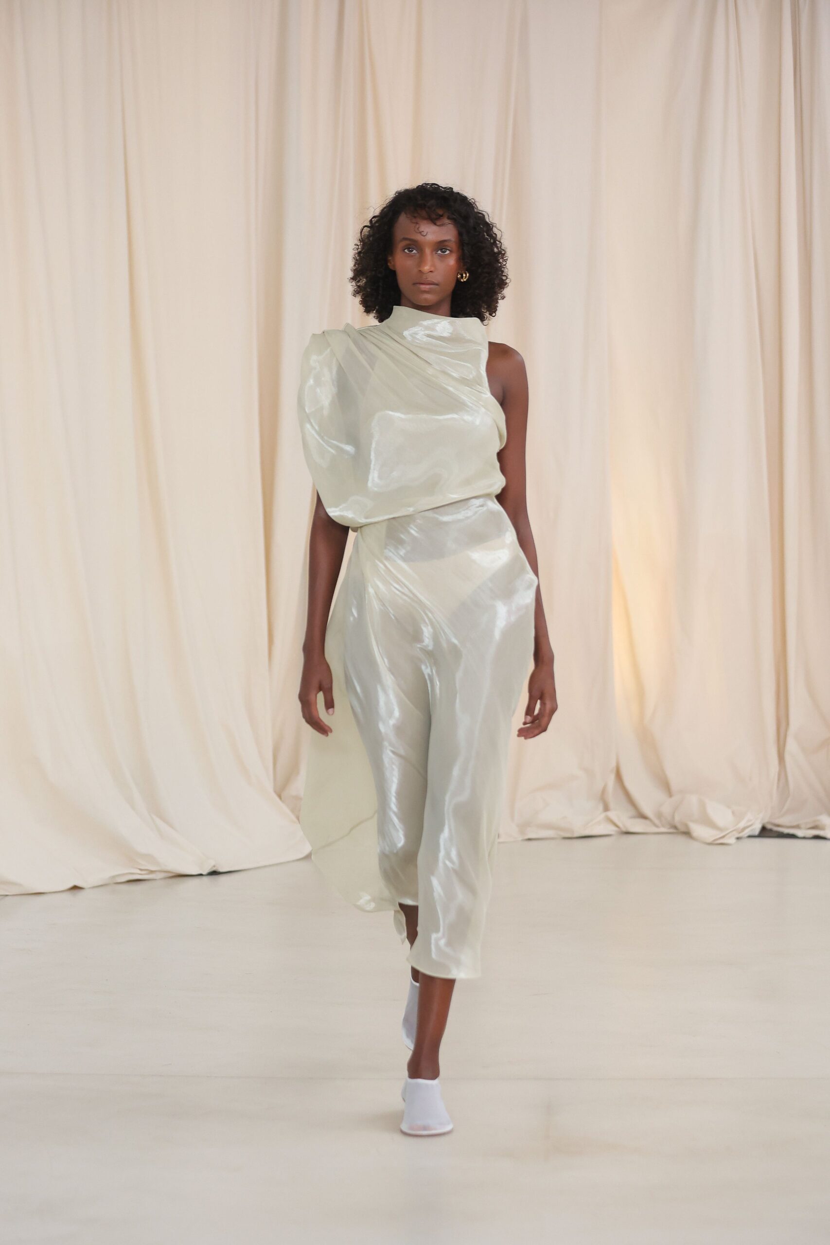 white silk sleeveless high-neck fitted draped layered jumpsuit