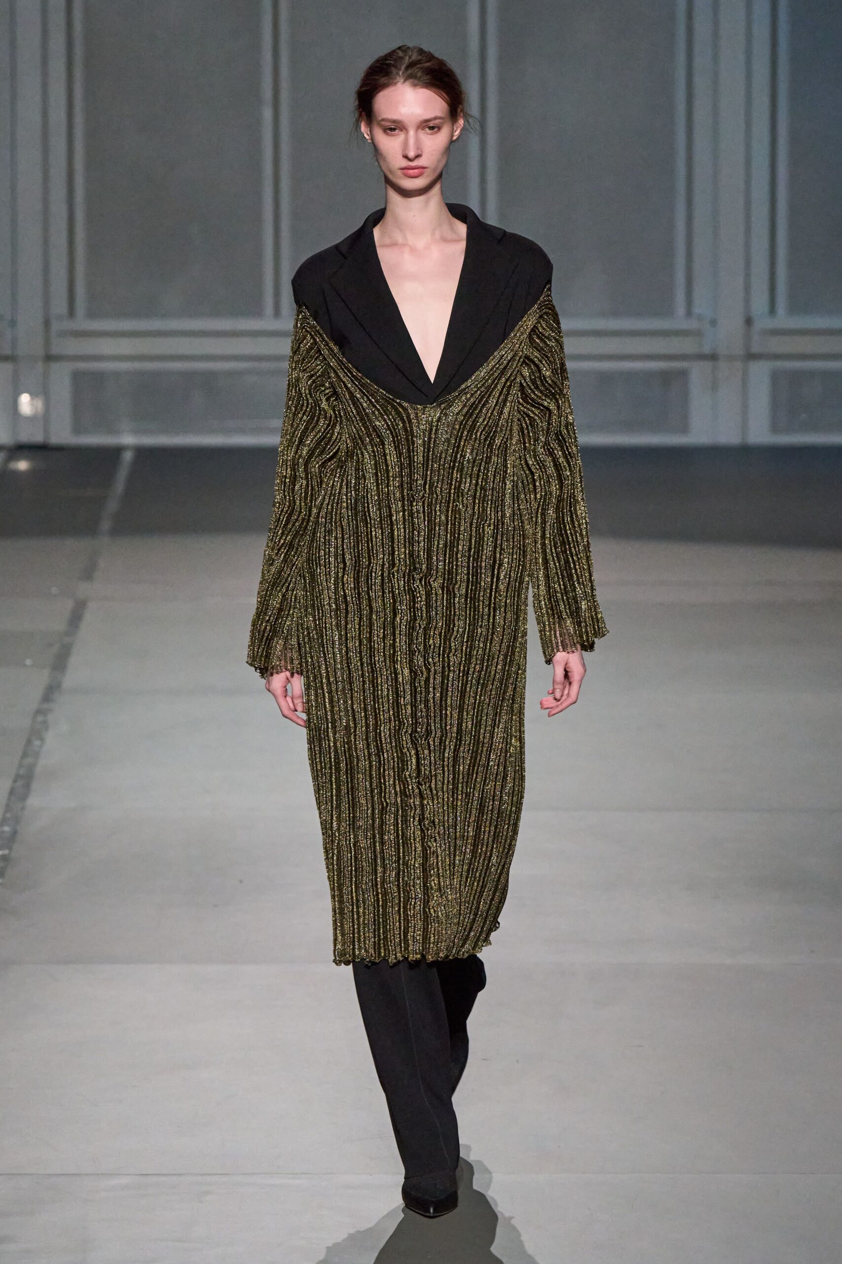 black and gold pleated coat